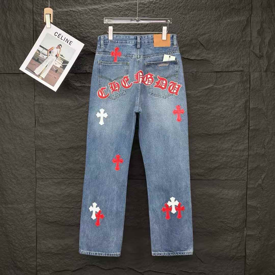 chrome hearts light-wash denim jeans with red and white cross patches