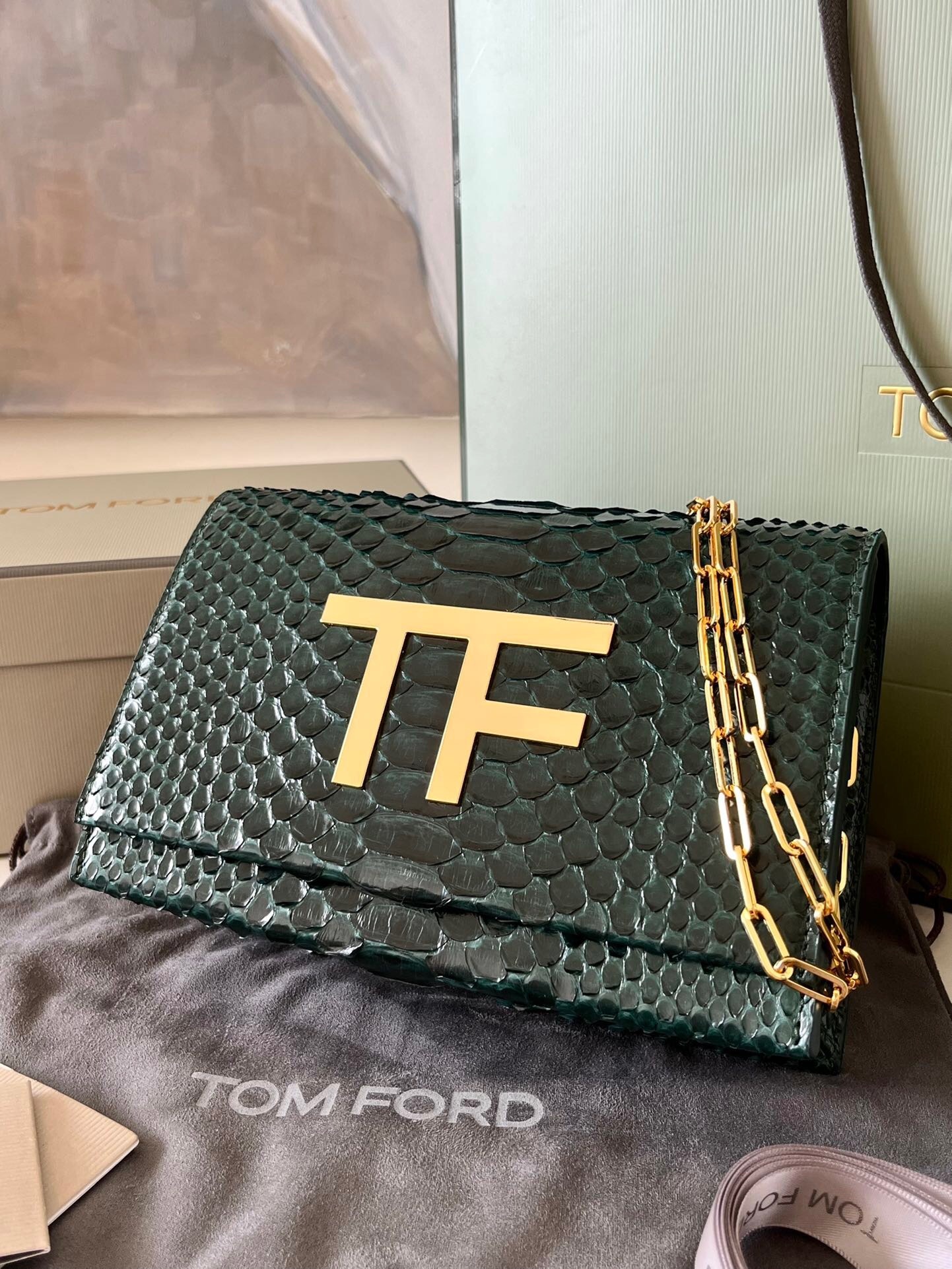 Tom Ford Icon Disco bag in green python-embossed leather with a gold-tone "TF" logo and chain strap