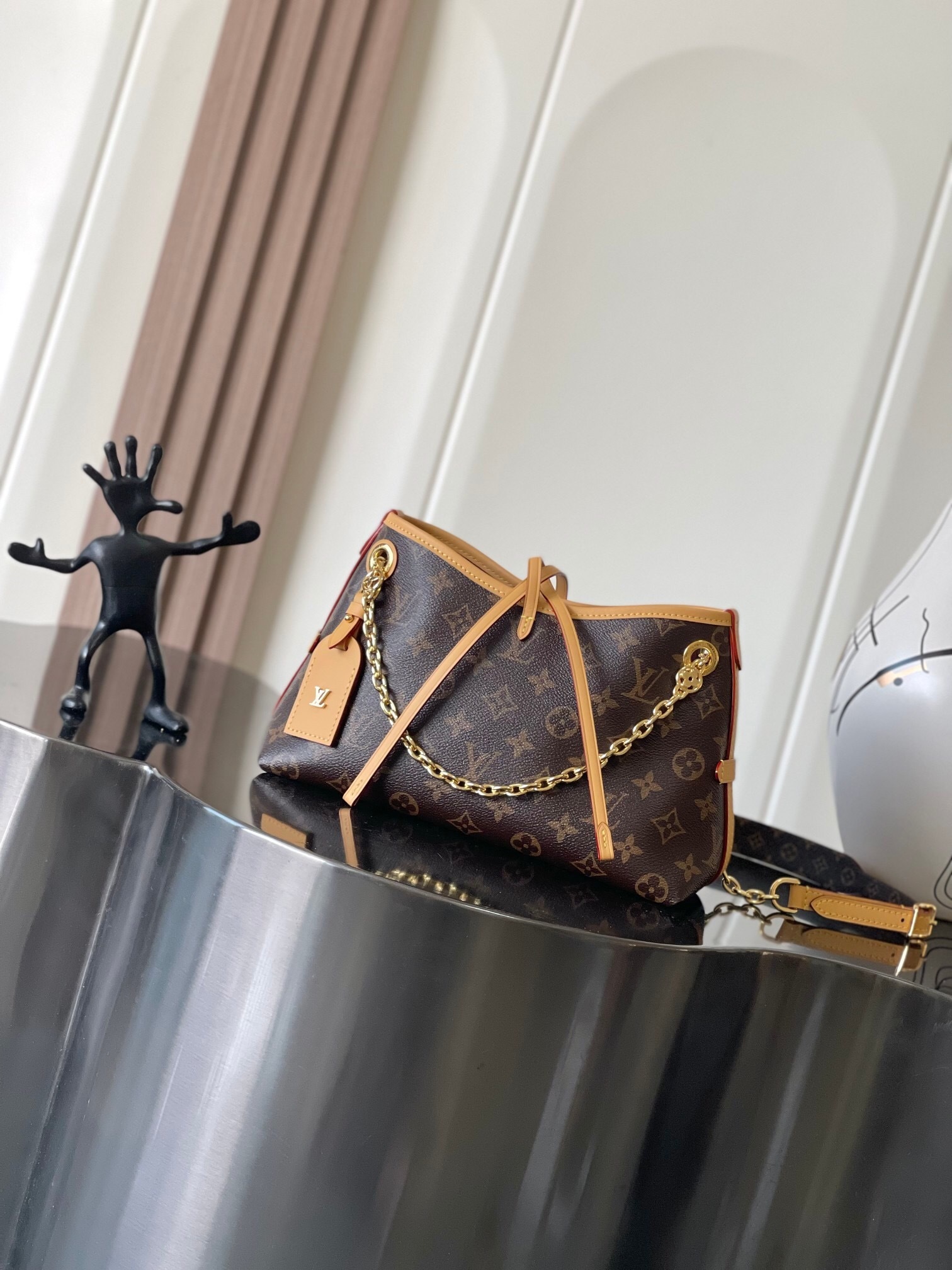 LV CarryAll BB bag in Monogram canvas with natural cowhide-leather trim