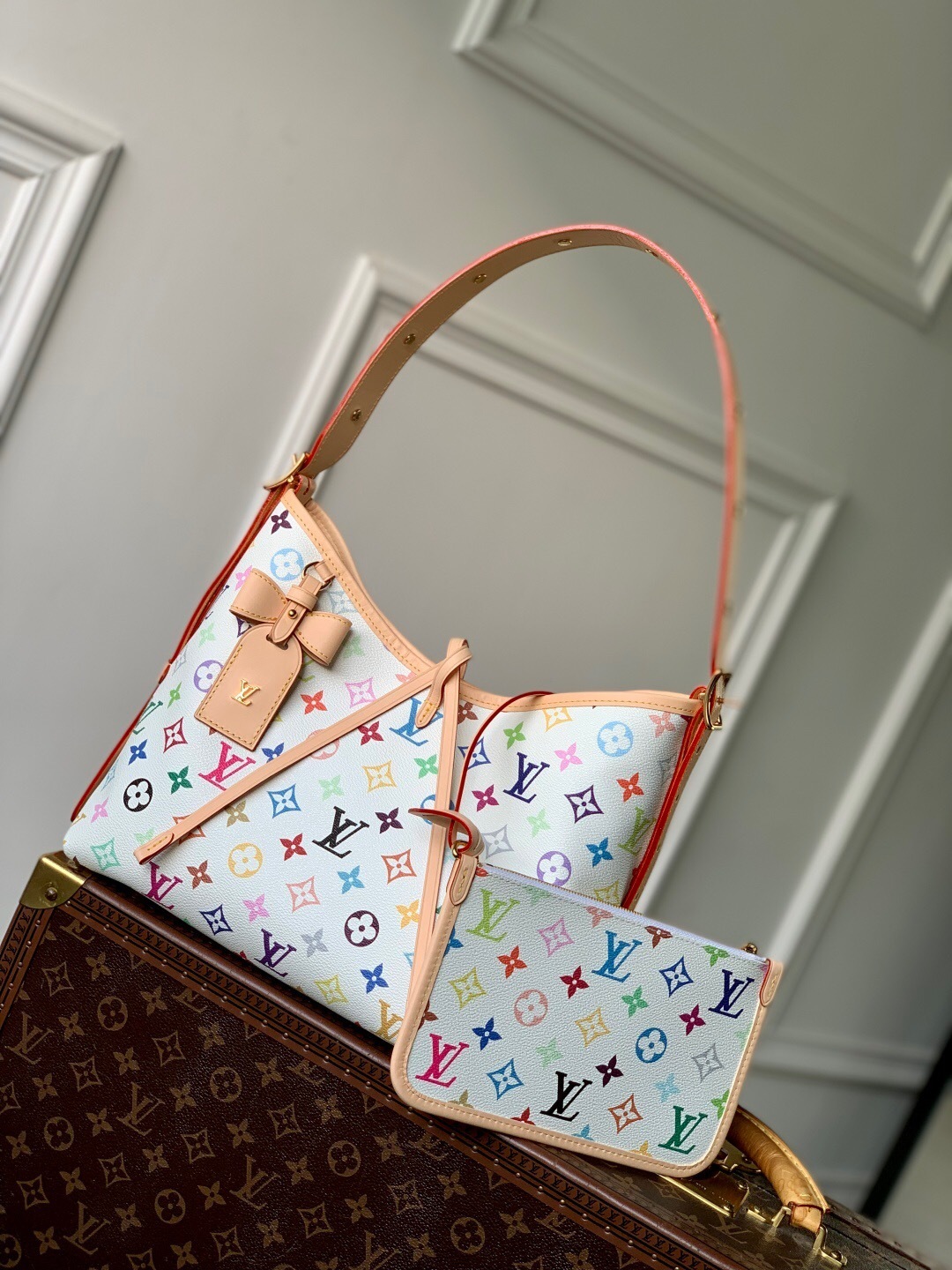 LV x Takashi Murakami CarryAll PM handbag with a white multicolor monogram canvas and natural leather trim