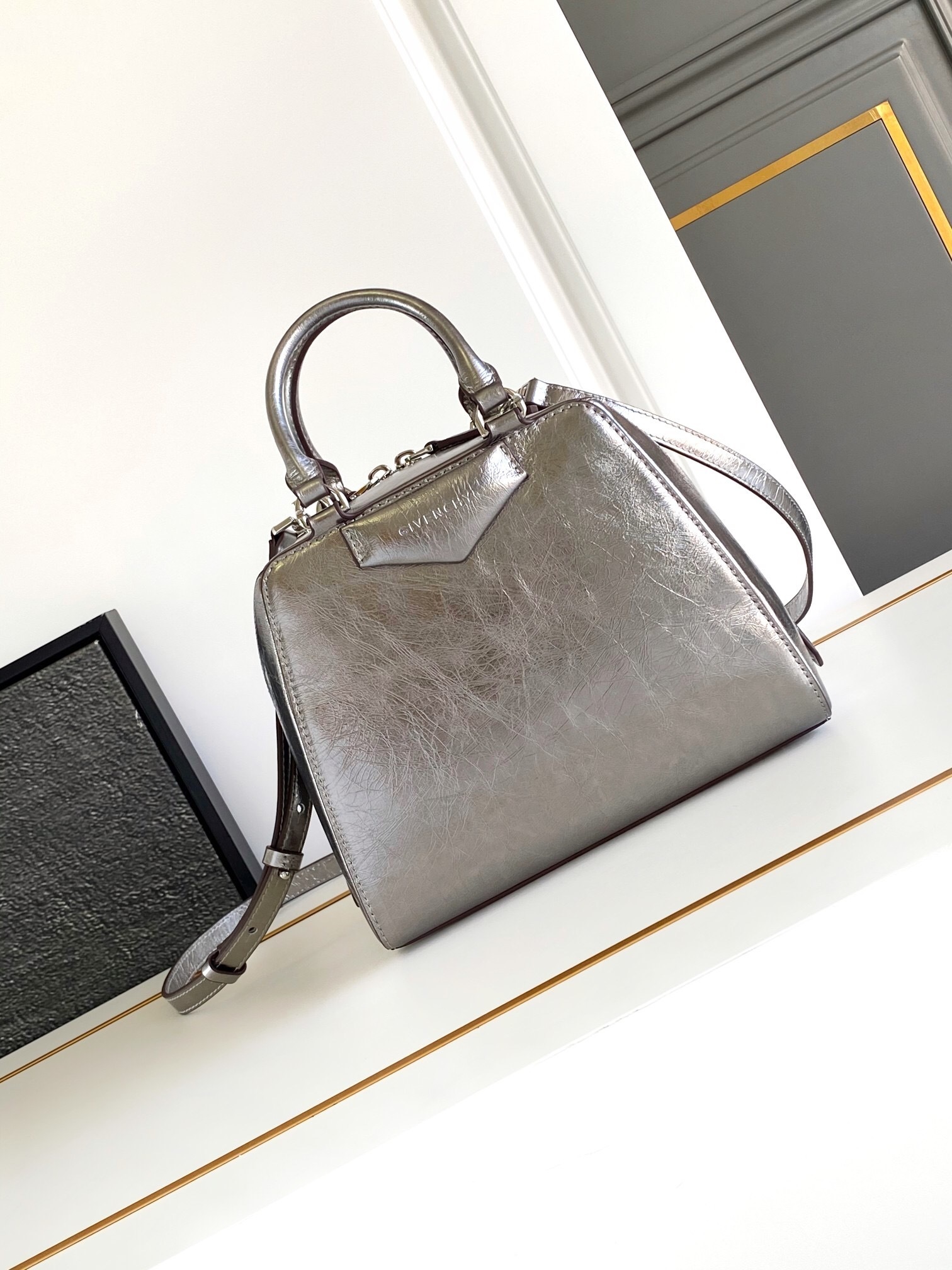 Givenchy Nano Antigona Cube bag in metallic silver laminated lambskin or patent leather