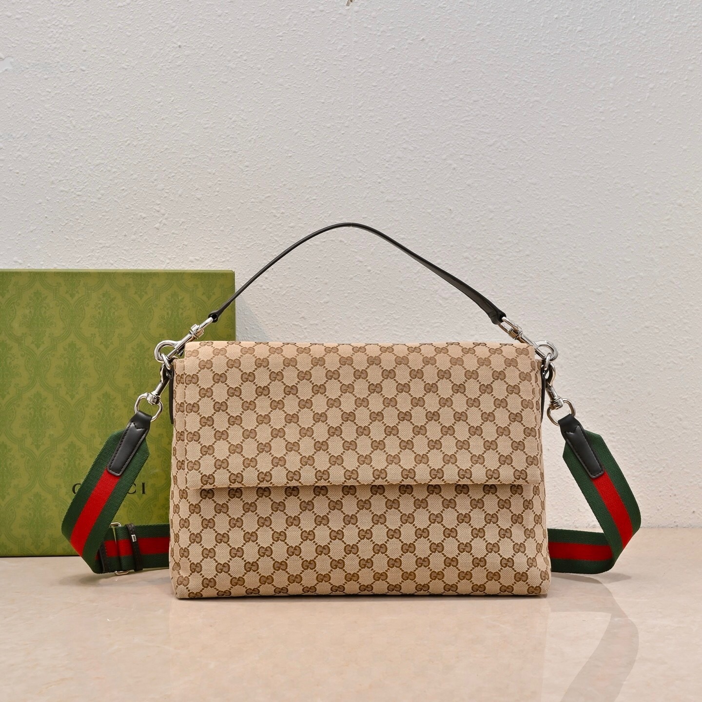 Gucci GG canvas medium crossbody bag in beige with a detachable leather handle and an adjustable/removable Web fabric strap