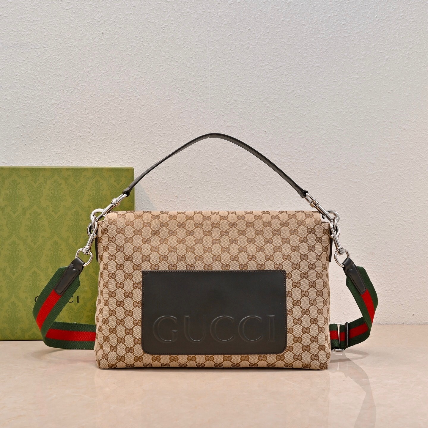 Gucci GG canvas medium crossbody bag in beige with a detachable leather handle and an adjustable/removable Web fabric strap