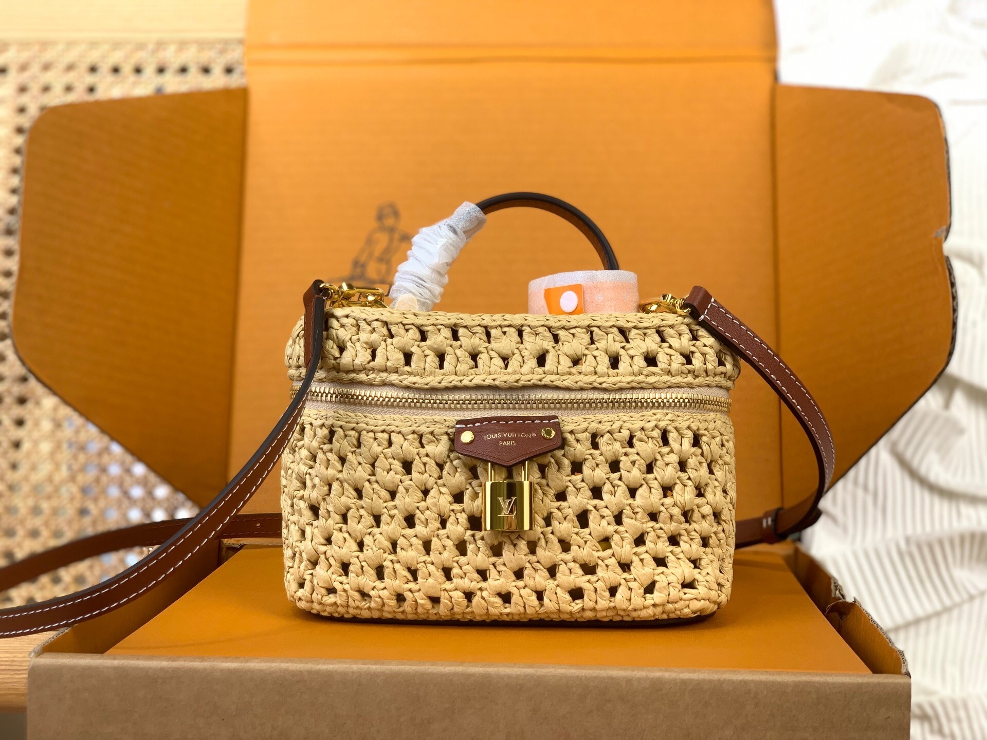 LV Vanity Chain Pouch in seasonal raffia with cowhide-leather trim and gold-toned hardware