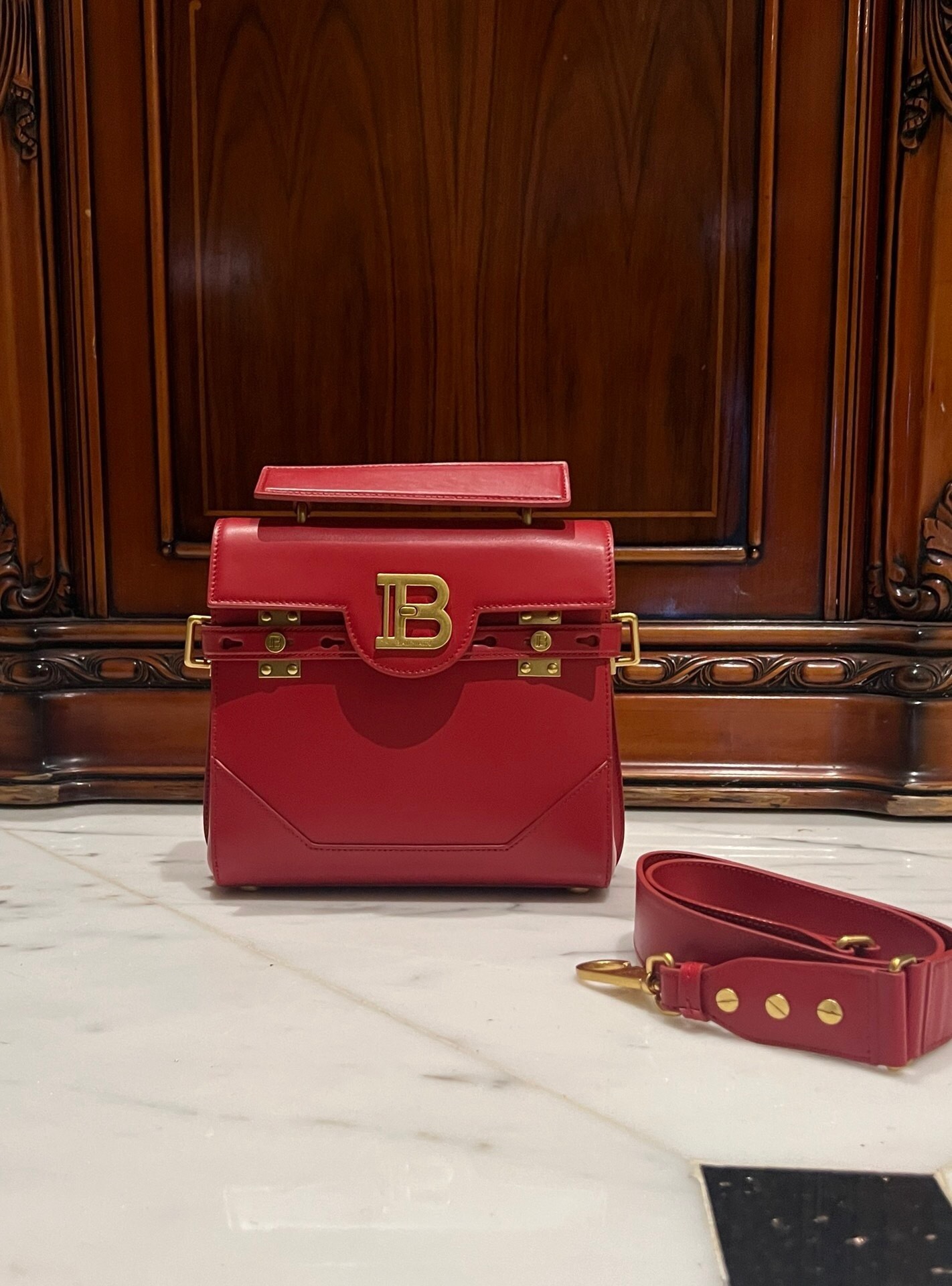 Balmain B-Buzz 23 top-handle satchel bag in red smooth calf leather with gold-tone hardware