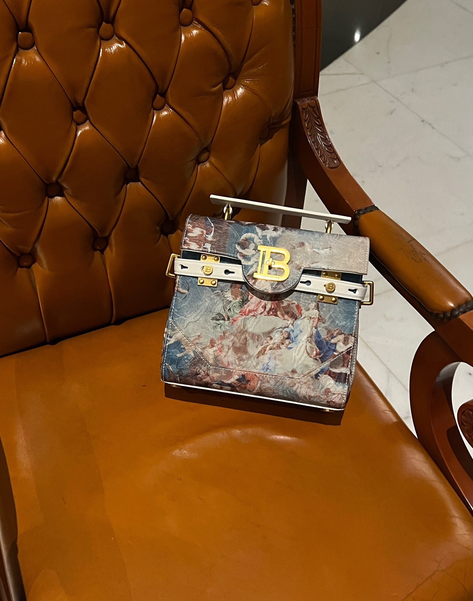 Balmain B-Buzz 23 bag in a canvas and leather combination with an embroidered or printed