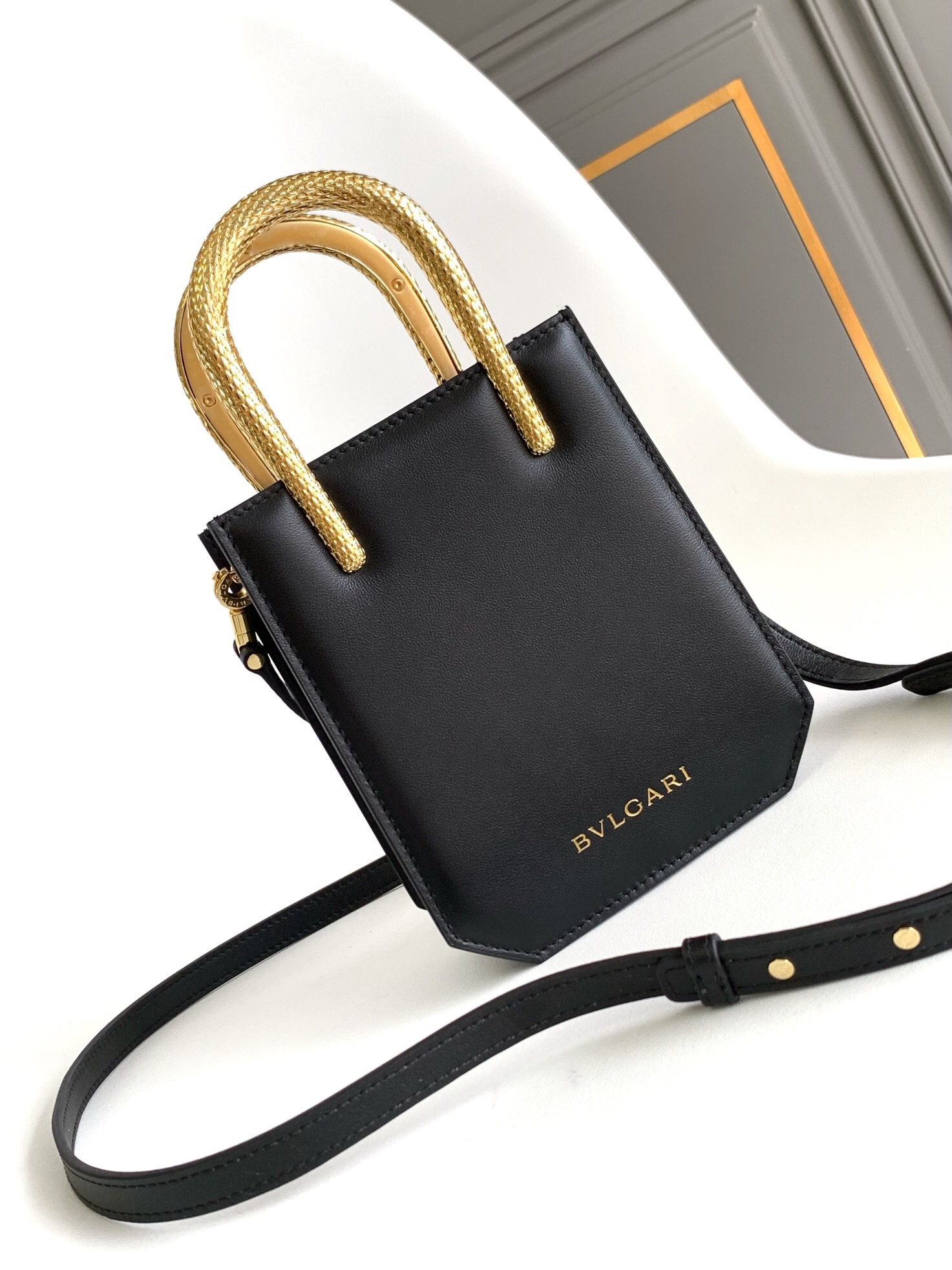 Bulgari Serpentine mini tote bag in black calf leather with gold-plated brass snake-shaped handle