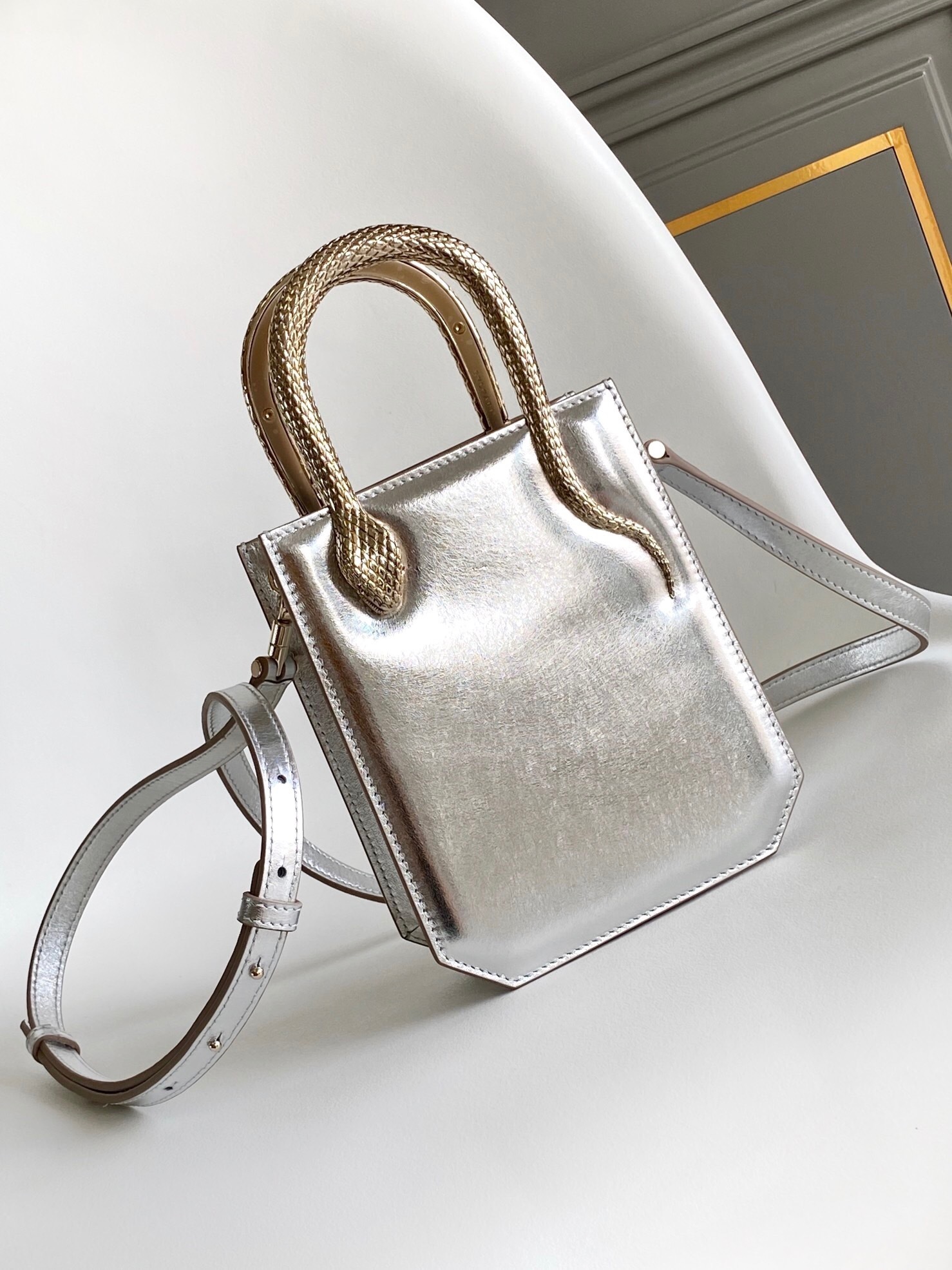 Bvlgari Serpentine mini tote bag in metallic silver calf leather with gold-toned snake-shaped top handles