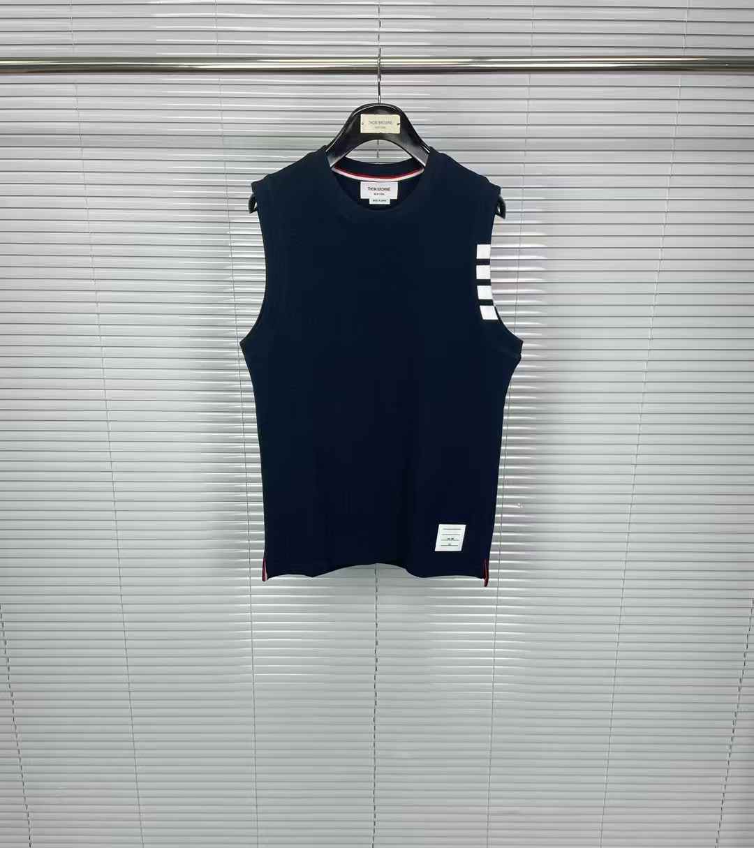 Thom Browne navy sleeveless cashmere knit vest white 4-bar stripes on the left armhole and red, white, and blue grosgrain
