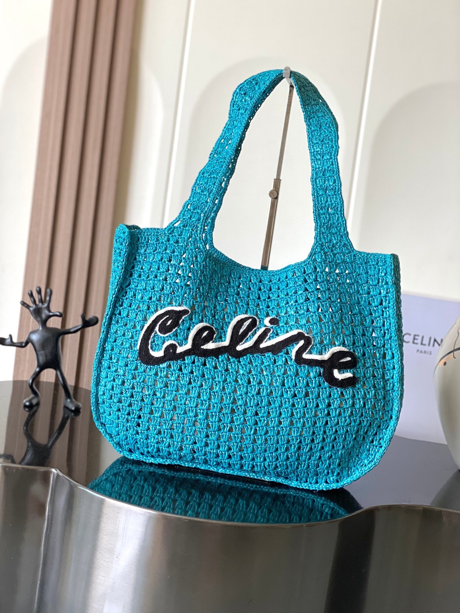 CELINE HOMME logo-appliquéd raffia tote bag in turquoise