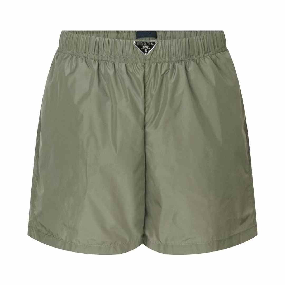Prada Re-Nylon swim trunks in a military green color
