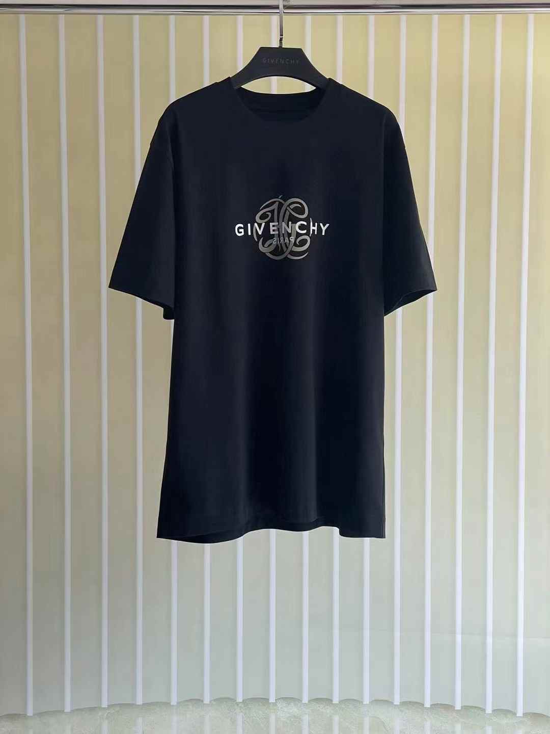 Givenchy Reverse oversized cotton T-shirt in black with a reverse-effect logo print on the chest