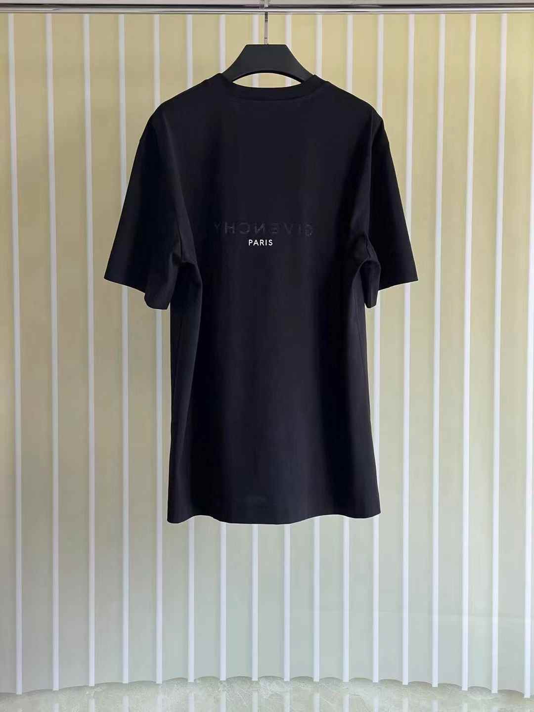 Givenchy Reverse oversized cotton T-shirt in black with a reverse-effect logo print on the chest