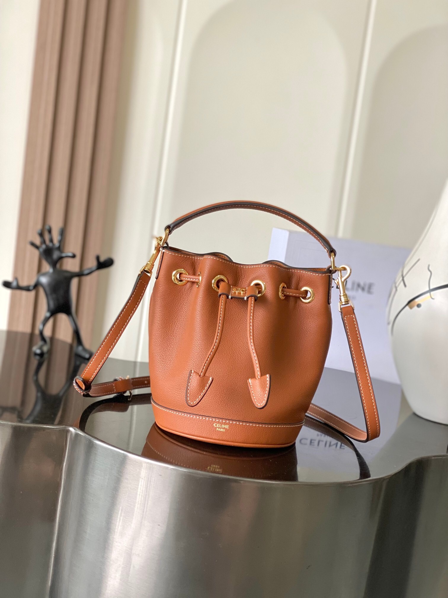Celine Clara drawstring bucket bag in triomphe canvas and calfskin leather
