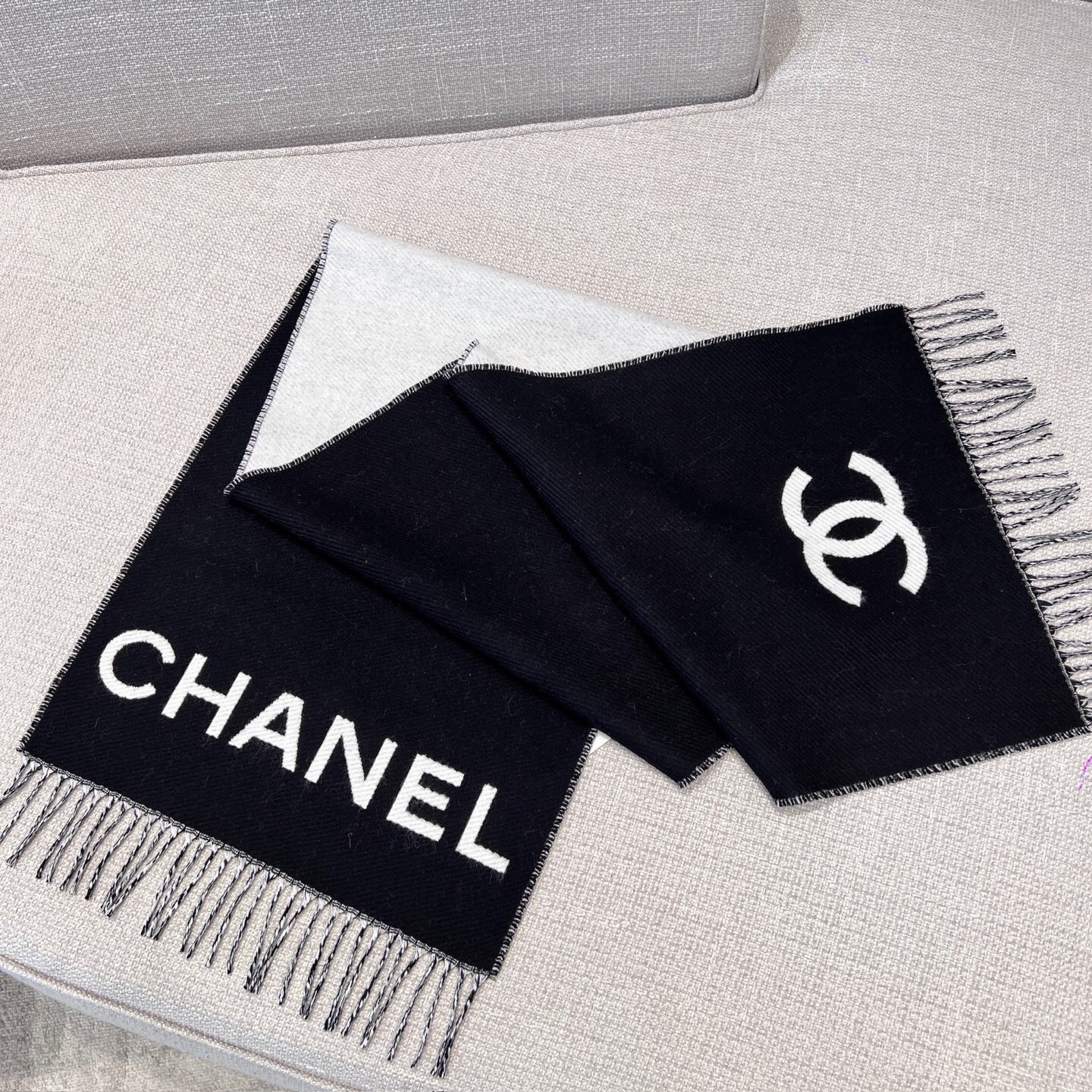 Chanel cashmere scarf with the brand name and logo