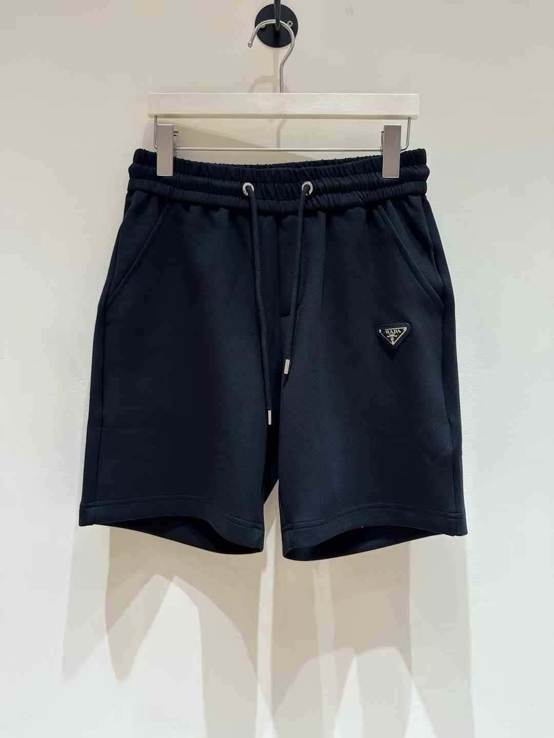 Prada Re-Nylon shorts with an enameled metal triangle logo black
