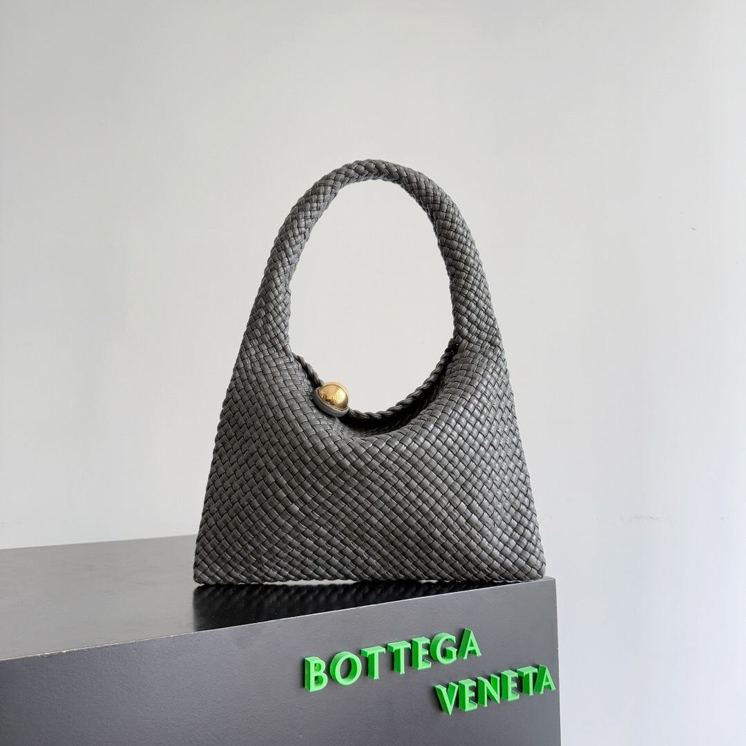 ottega Veneta Tosca Baci shoulder bag in black intrecciato leather with a gold-finish sculptural sphere embellishment