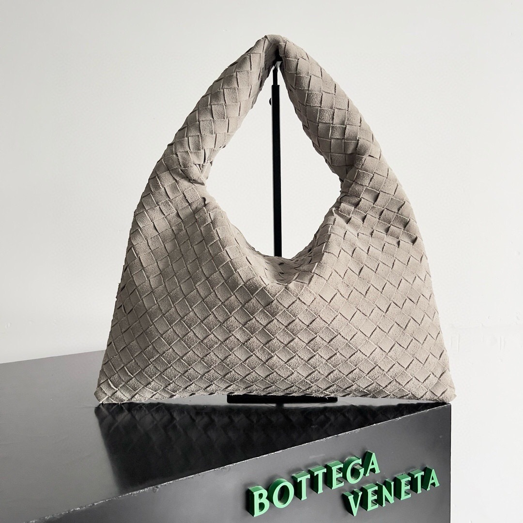 Bottega Veneta Hop shoulder bag in a beige or light gray suede-effect material