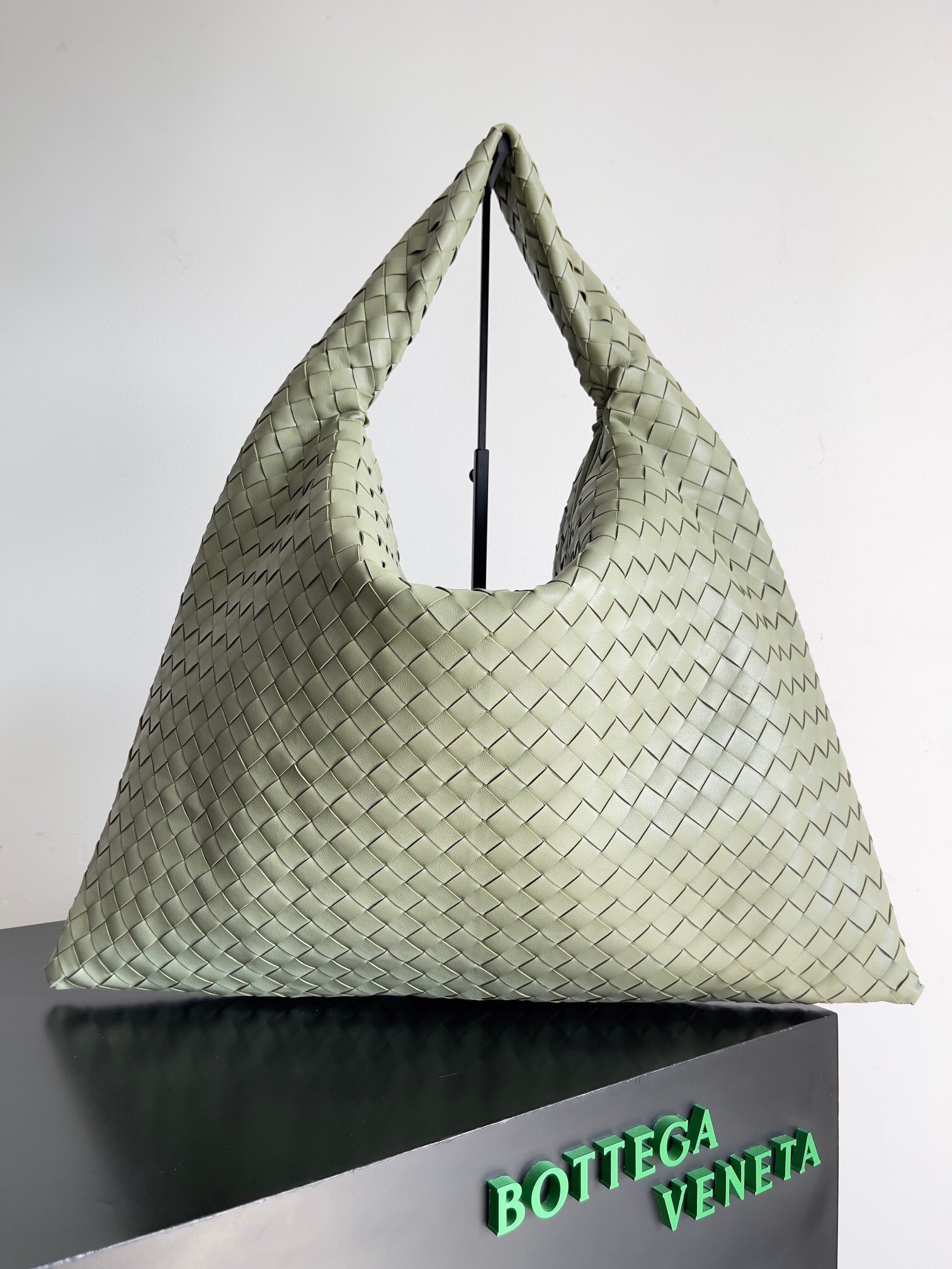 Bottega Veneta Hop shoulder bag in intrecciato leather, likely in the "Aloe" color
