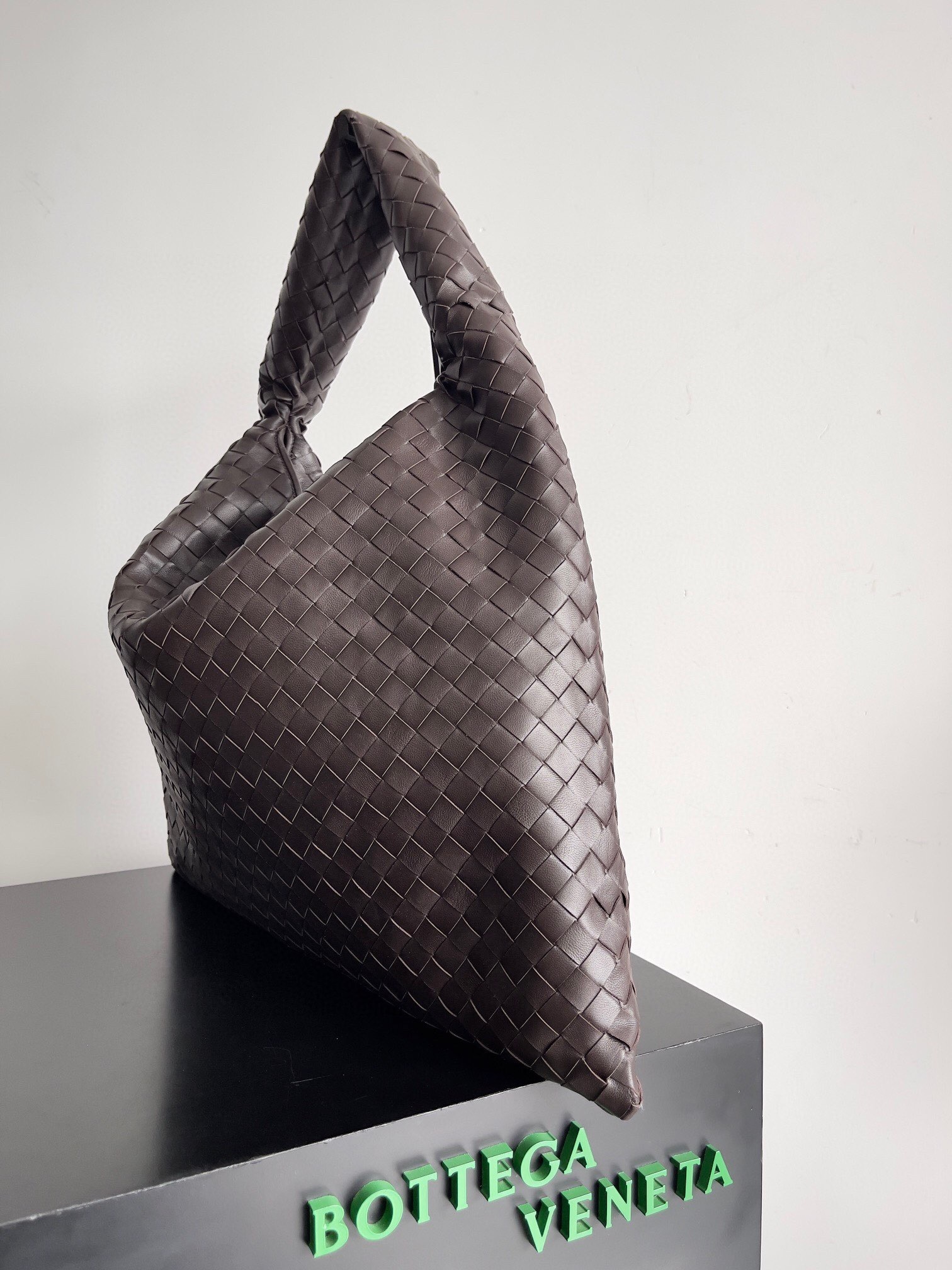 Bottega Veneta Intrecciato woven leather hobo bag in a brown or taupe color