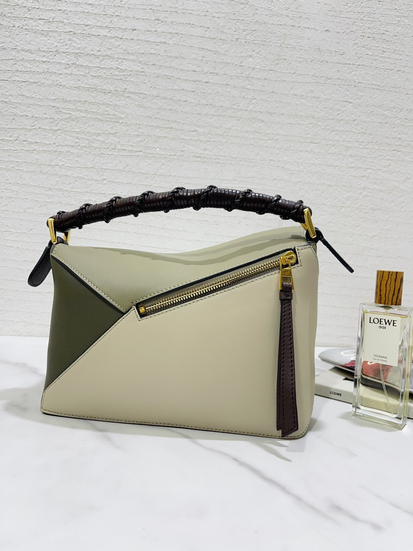 Loewe Puzzle Edge Small Bag in soft grained calfskin with a woven top handle