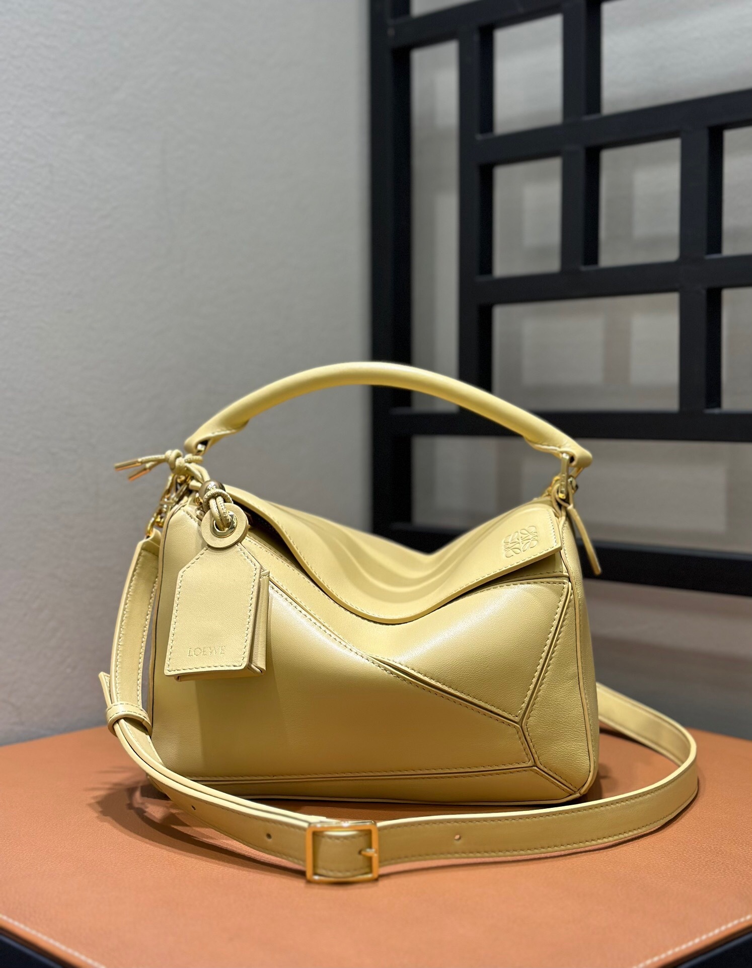 Loewe Small Featherlight Puzzle top handle bag in yellow lambskin leather