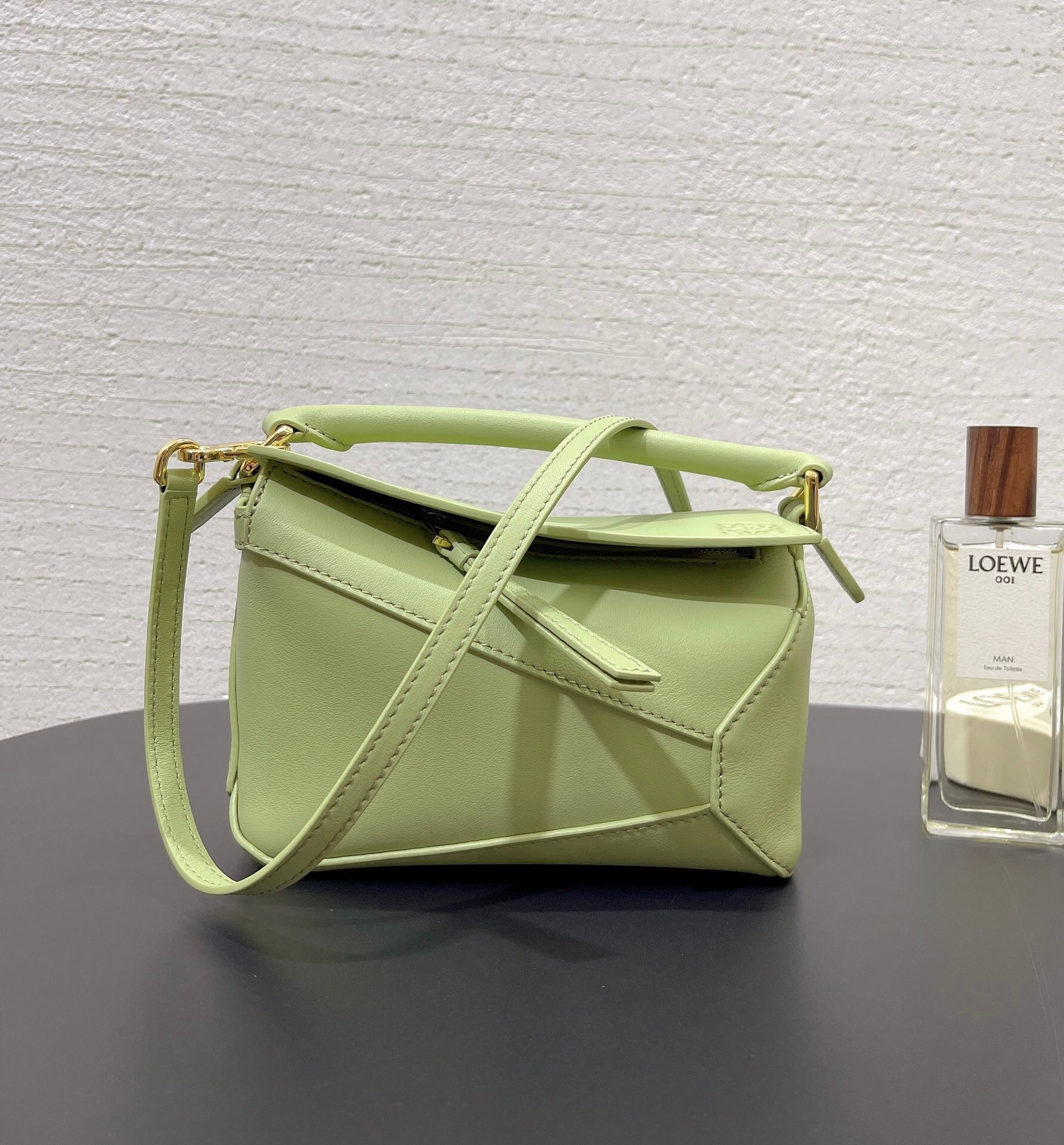 Loewe Mini Puzzle bag in classic calfskin and light pear or eucalyptus green