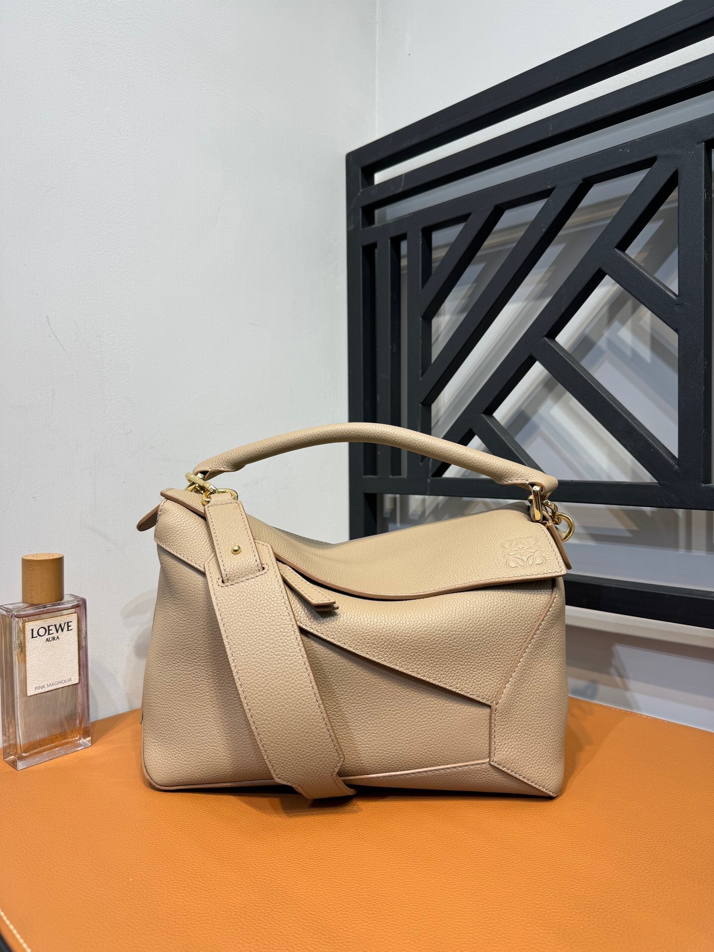 Loewe Puzzle Edge medium bag in a neutral beige or sand color leather