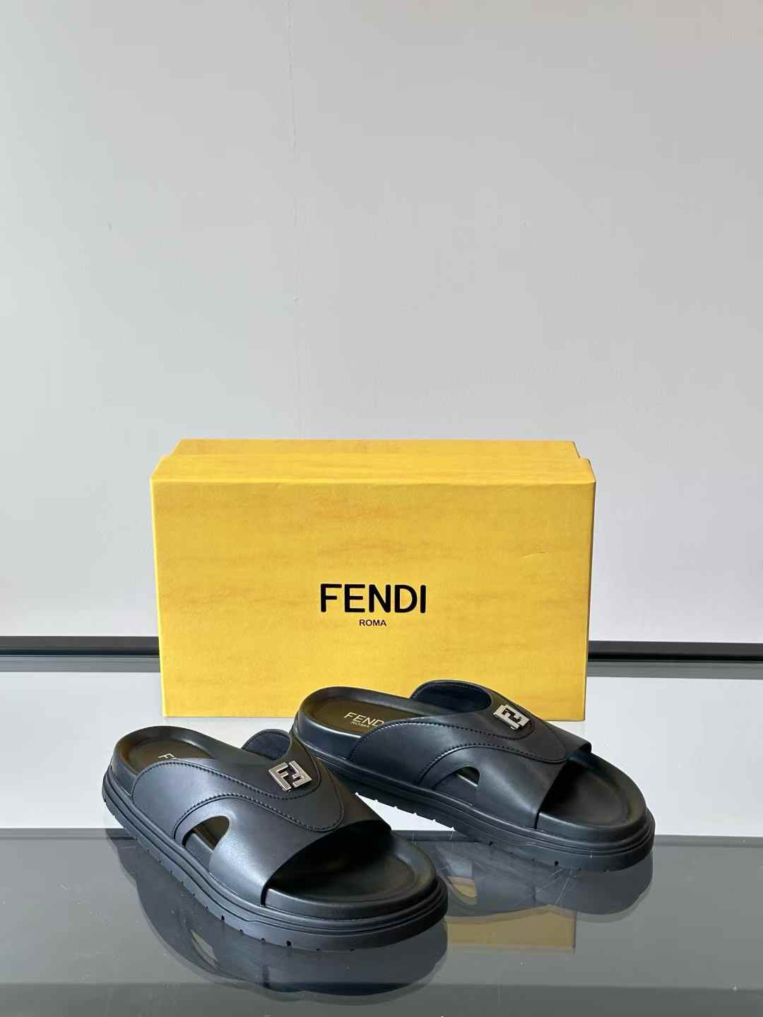 Fendi rubber slides with the signature FF logo on the strap