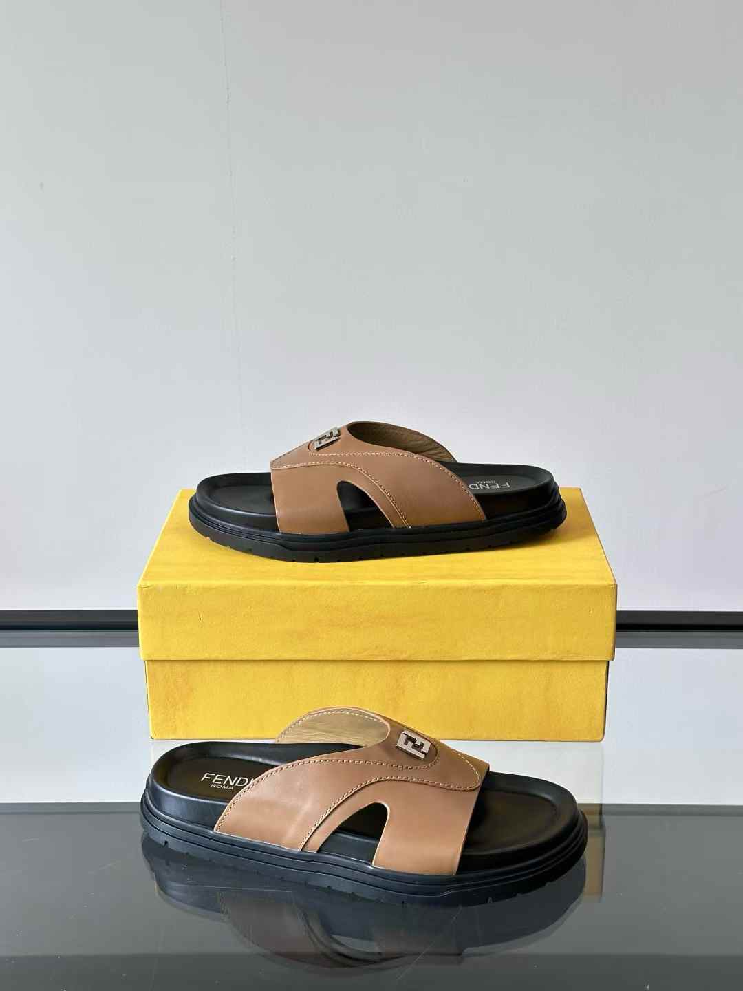 Fendi Feel sandal in brown fabric and black leather