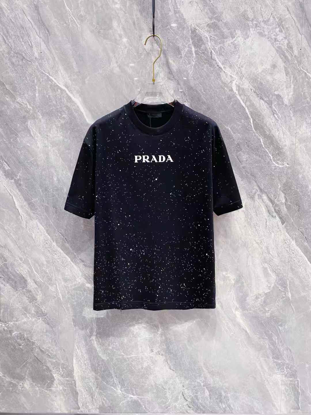 Prada T-shirt black with a speckled design and the brand's lettering logo on the chest