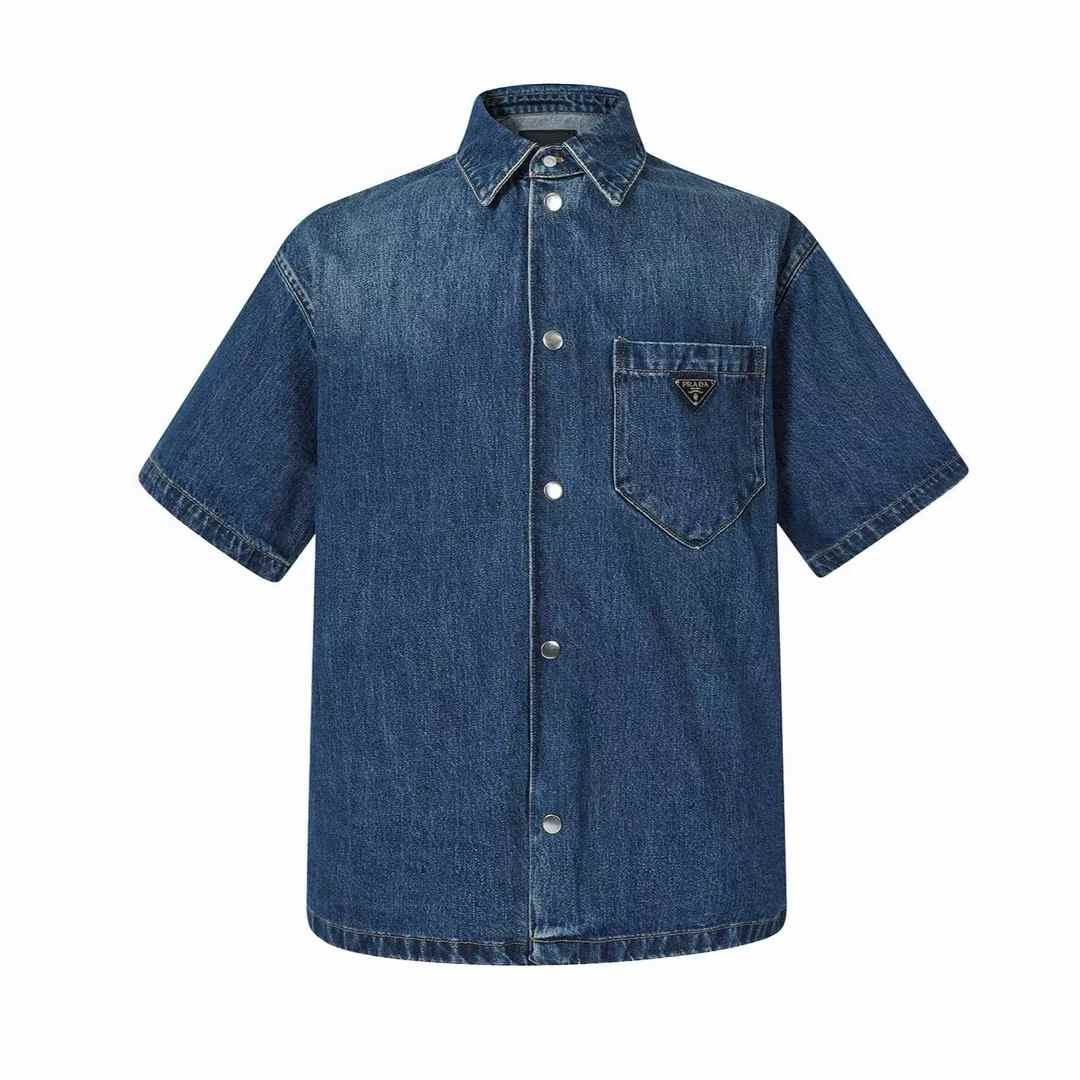 Prada short-sleeve denim shirt in a mid-blue wash with a boxy fit and an enameled metal triangle logo