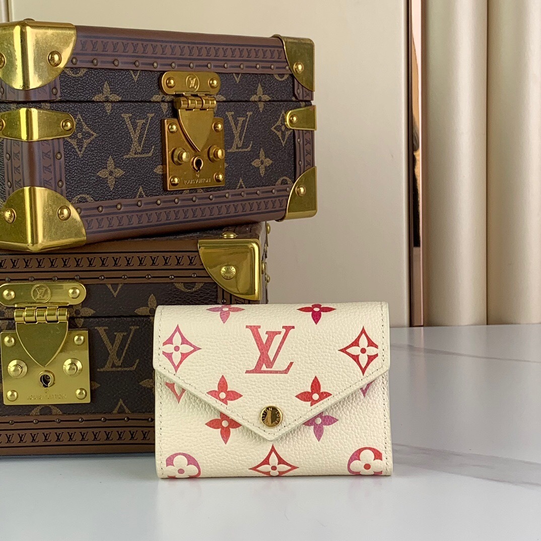LV Victorine Wallet in a cream color with pink Monogram Empreinte leather