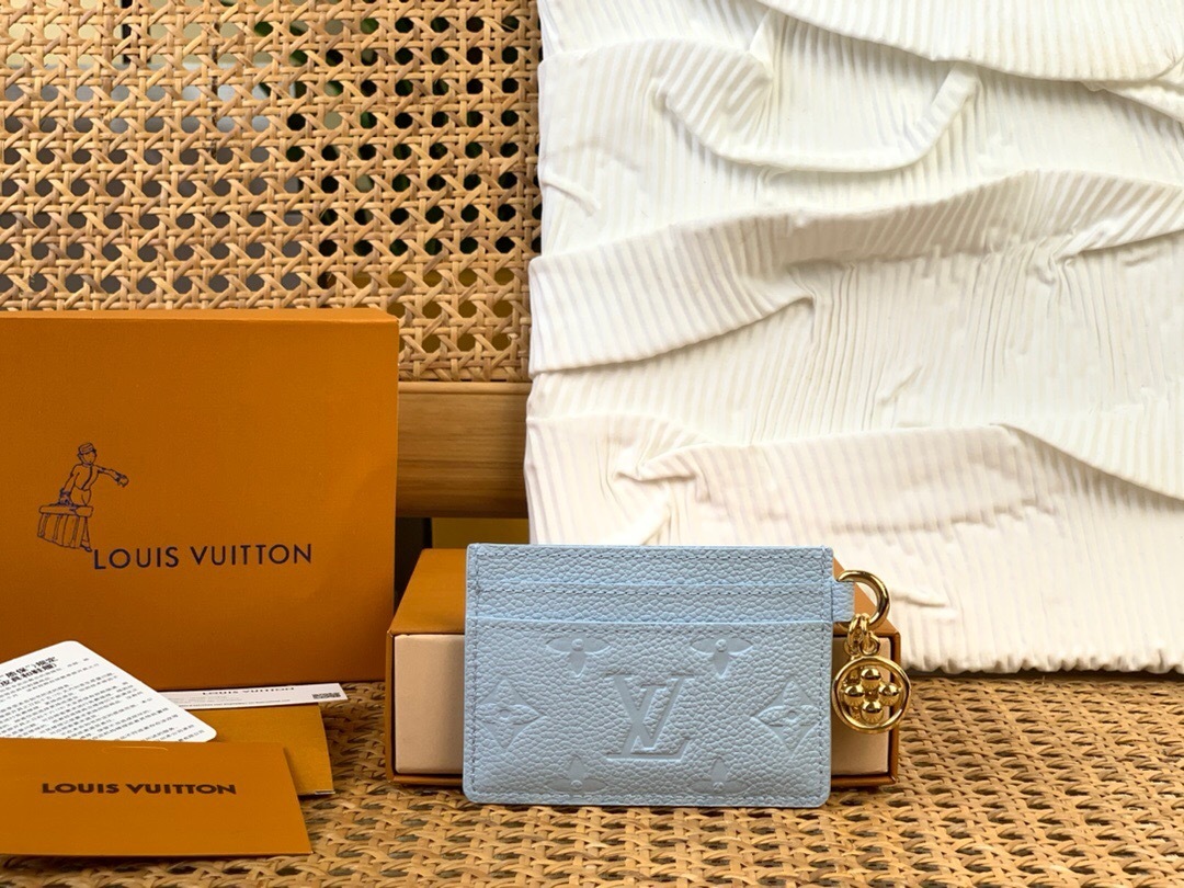 LV Charms Card Holder in light blue Monogram Empreinte leather.