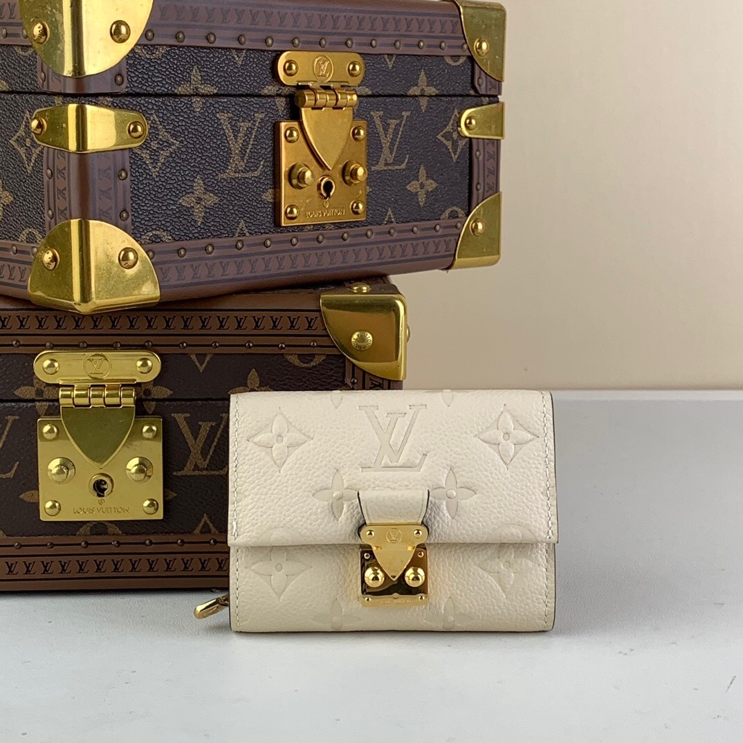 LV Métis Compact Wallet in Monogram Empreinte leather, Crème Beige color, featuring an S-lock closure