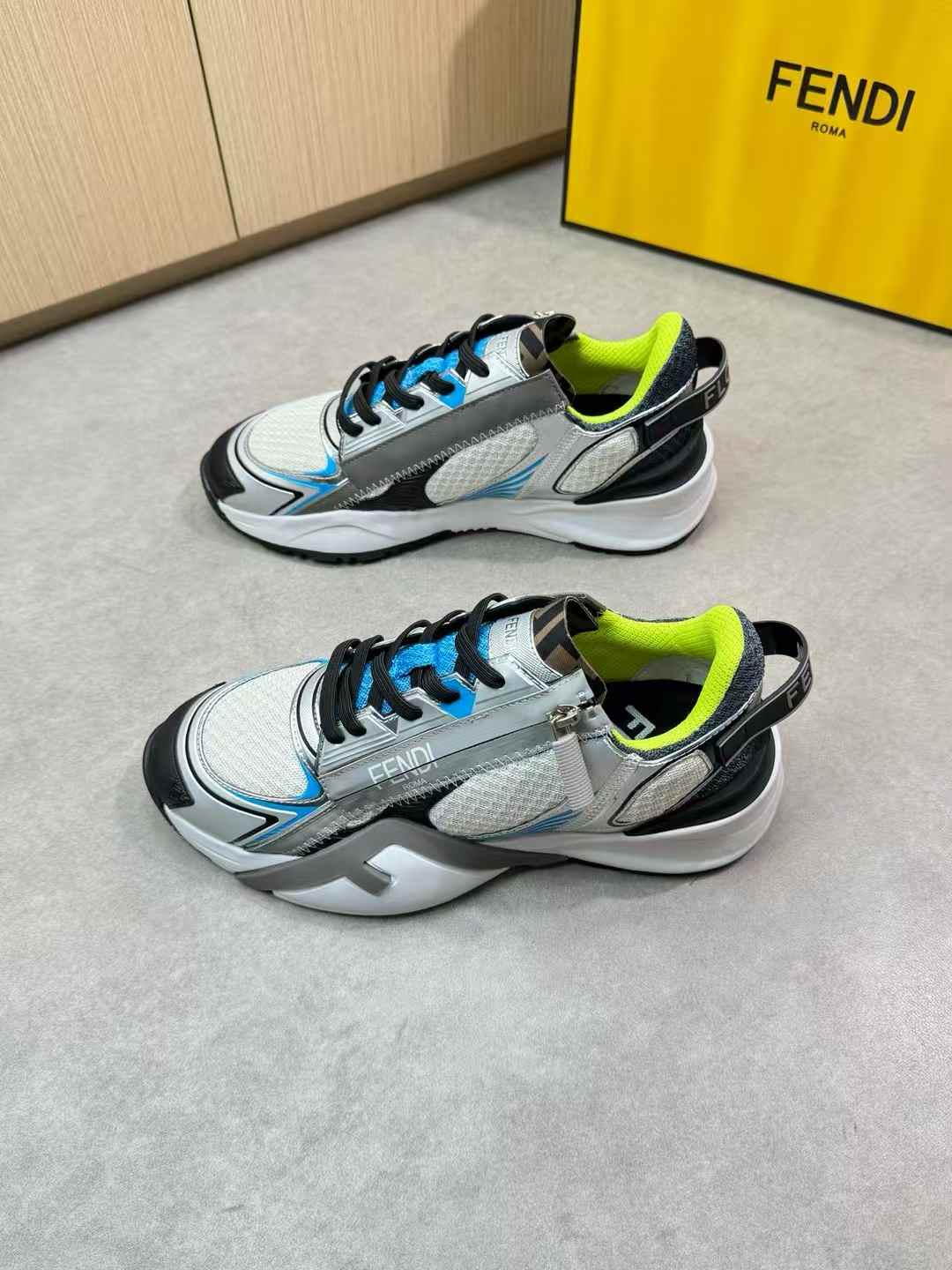 Fendi Flow sneakers in silver, blue, and white with elasticated laces and a side zip