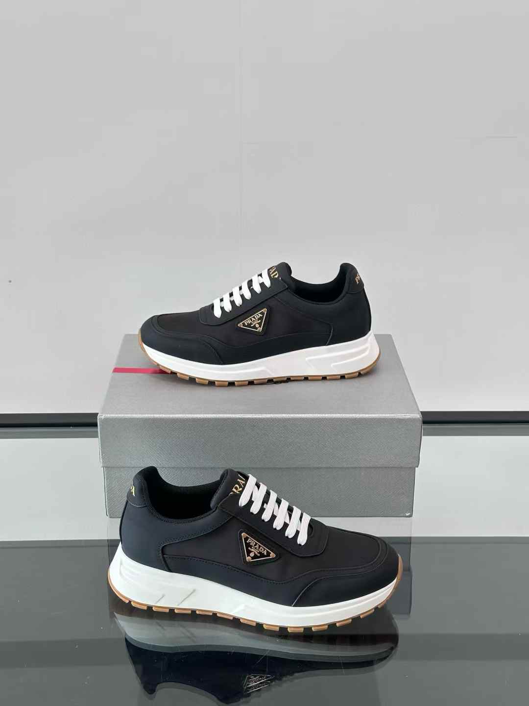 Prada Prax 01 Re-Nylon and brushed leather sneakers in black