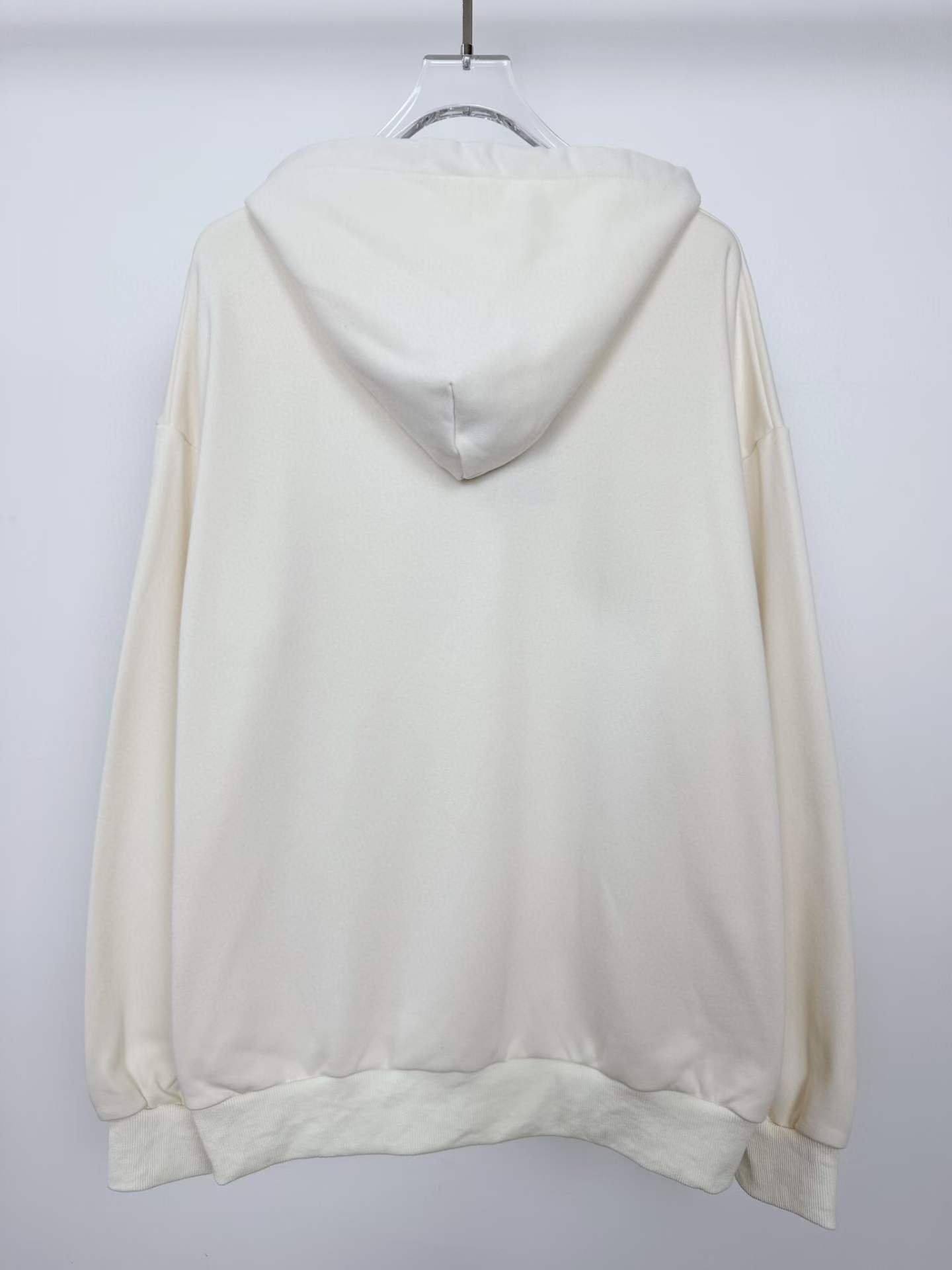 LV Printed Signature Hoodie in Milky White with a blue Flower motif on the chest.