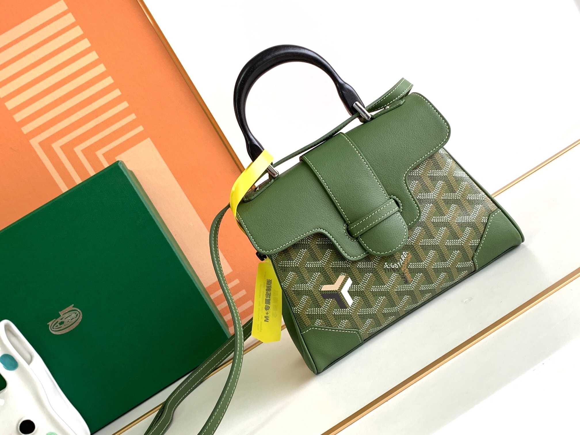 Goyard Saïgon Souple Mini bag in green Goyardine canvas with a hand-carved beechwood top handle and leather-reinforced corners