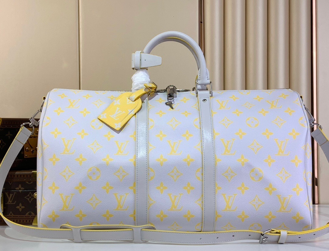 LV Keepall Bandoulière 50 Travel bag made from white Monogram Glow canvas with yellow