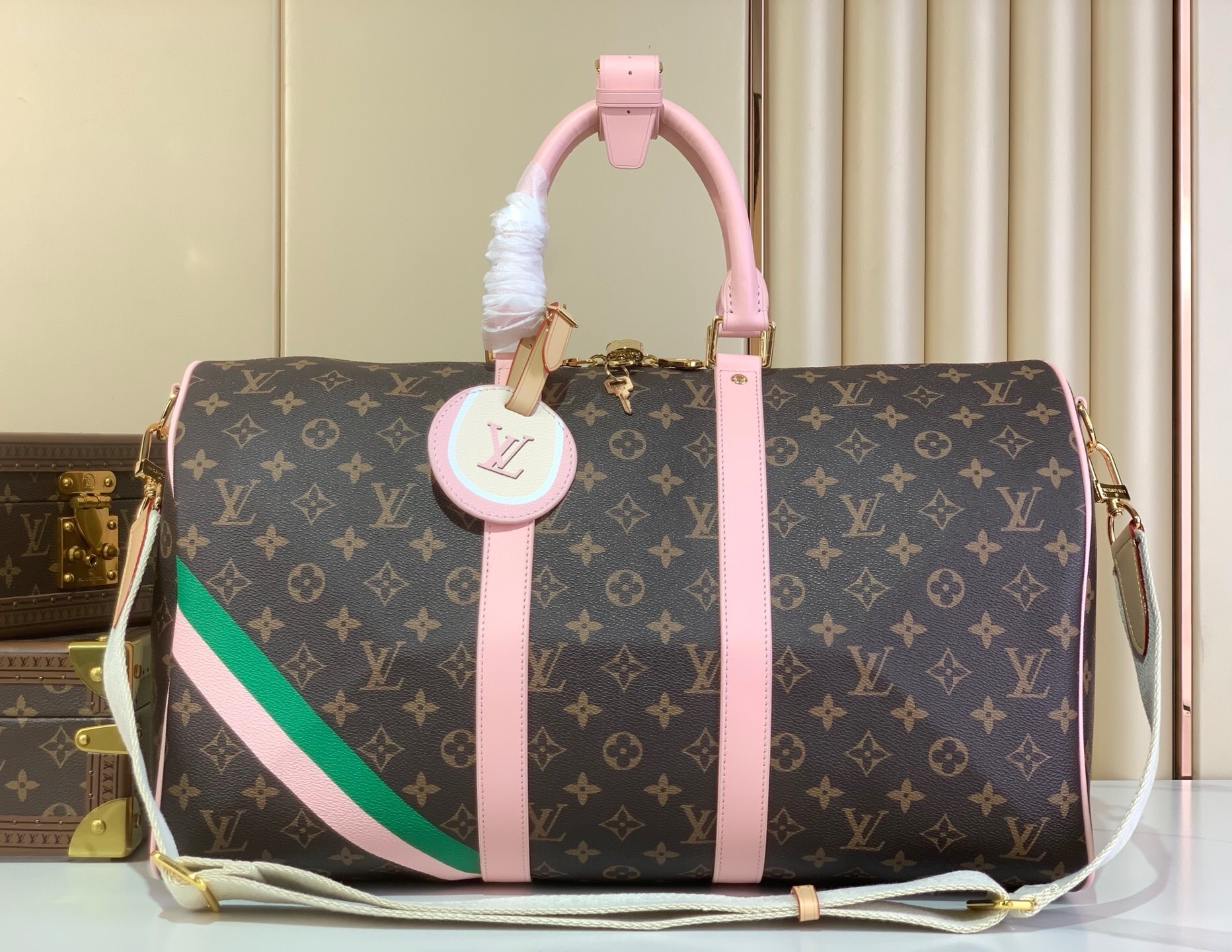 LV Keepall Bandoulière 45 bag from the Tennis Capsule collection Monogram canvas with pink and green stripes and pink leather details