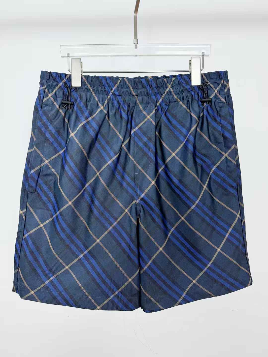 Burberry Check Bermuda shorts in the blue and grey colorway, likely made of cotton or silk