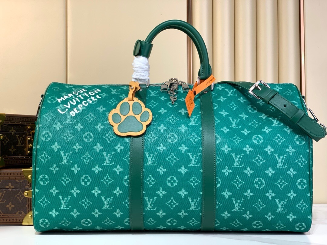 LV Keepall Bandoulière 50 travel bag in a green Monogram Heritage canvas with matching cowhide-leather trim