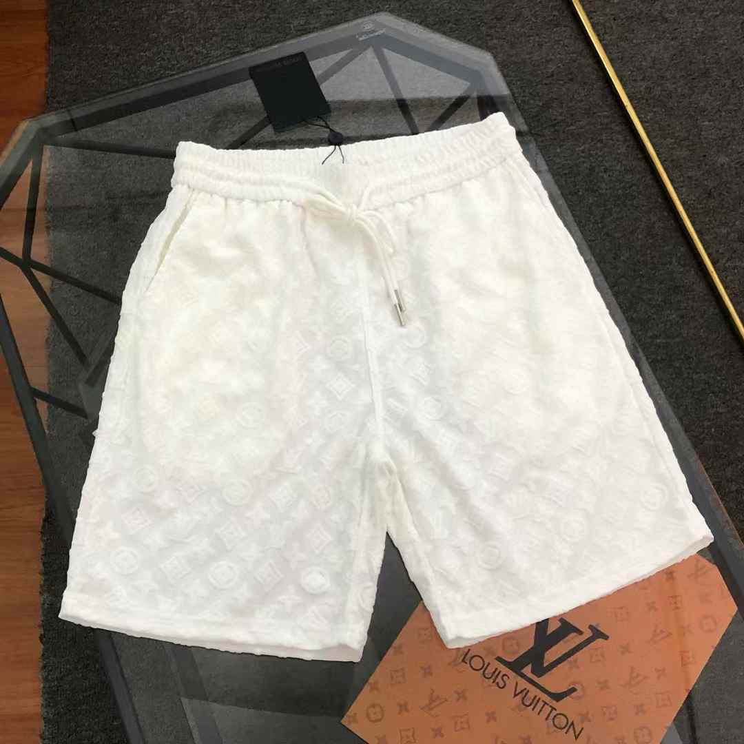 LV shorts with an embossed logo pattern