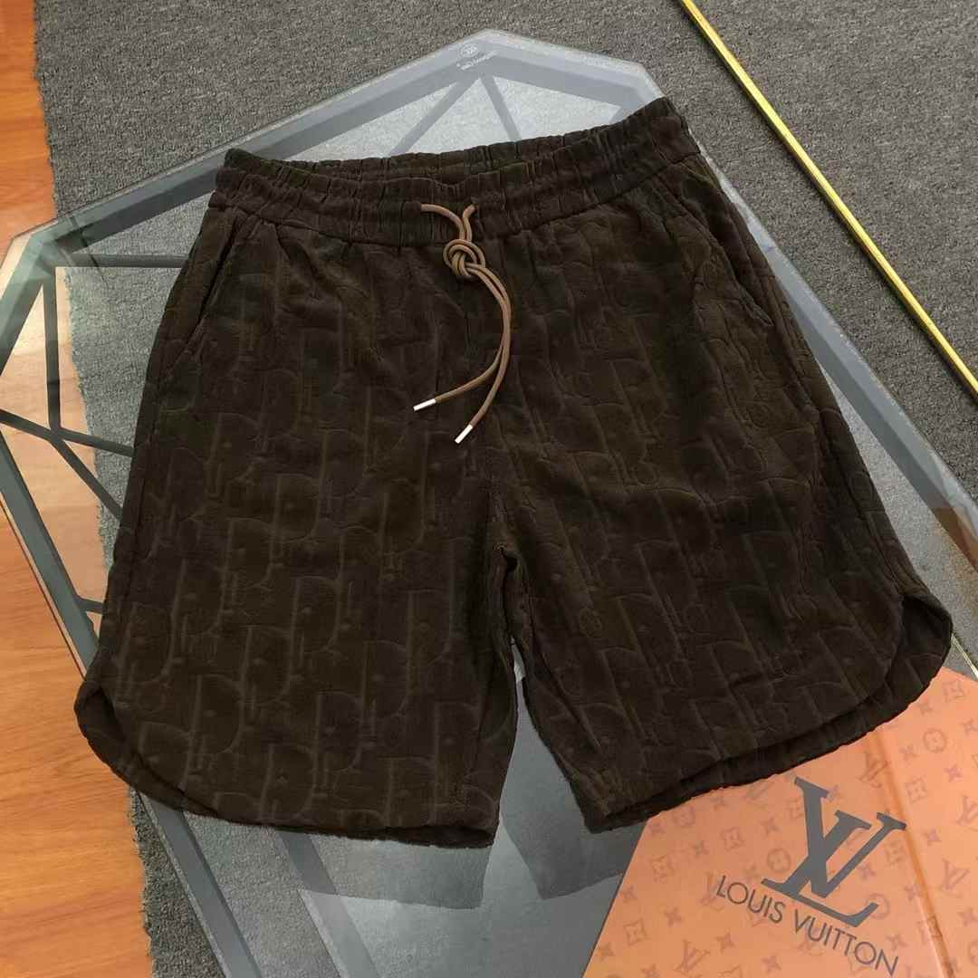 Dior shorts brown or dark-colored terry cloth material with an all-over tonal logo pattern.
