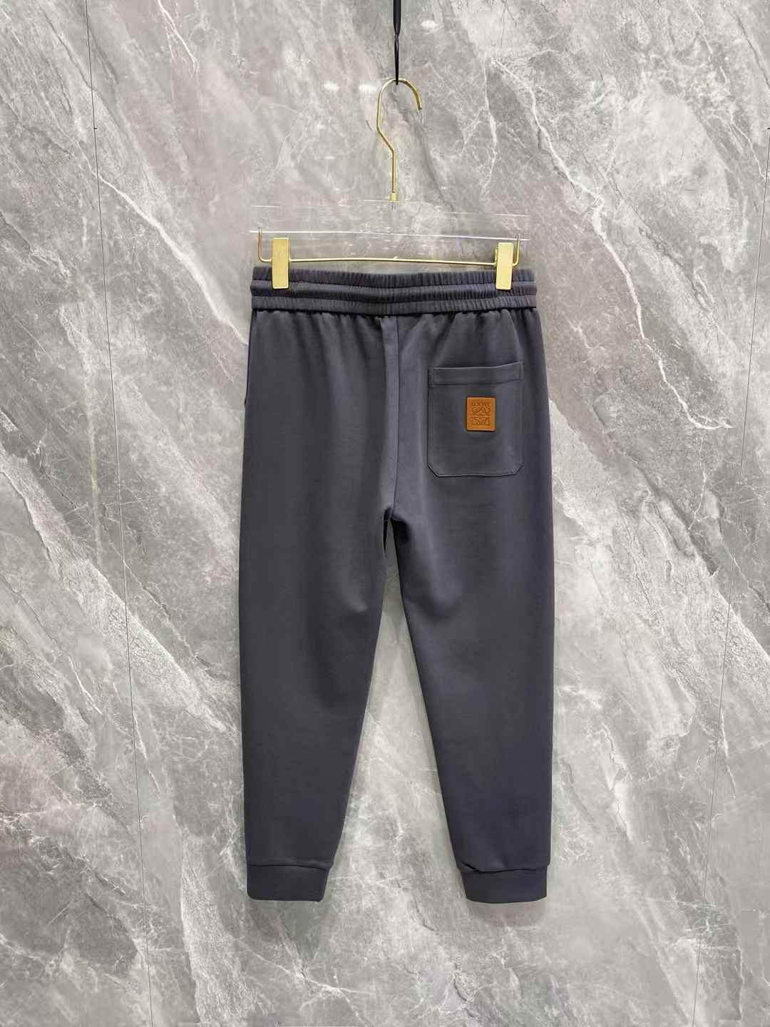 Loewe Anagram Embroidery Sweatpants in a dark grey or black cotton jersey
