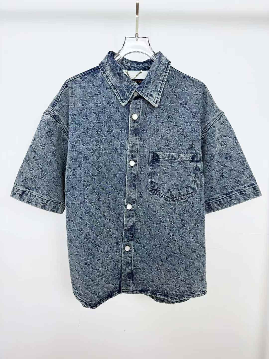 LV short-sleeved denim shirt with a washed/acid wash finish and a single chest pocket