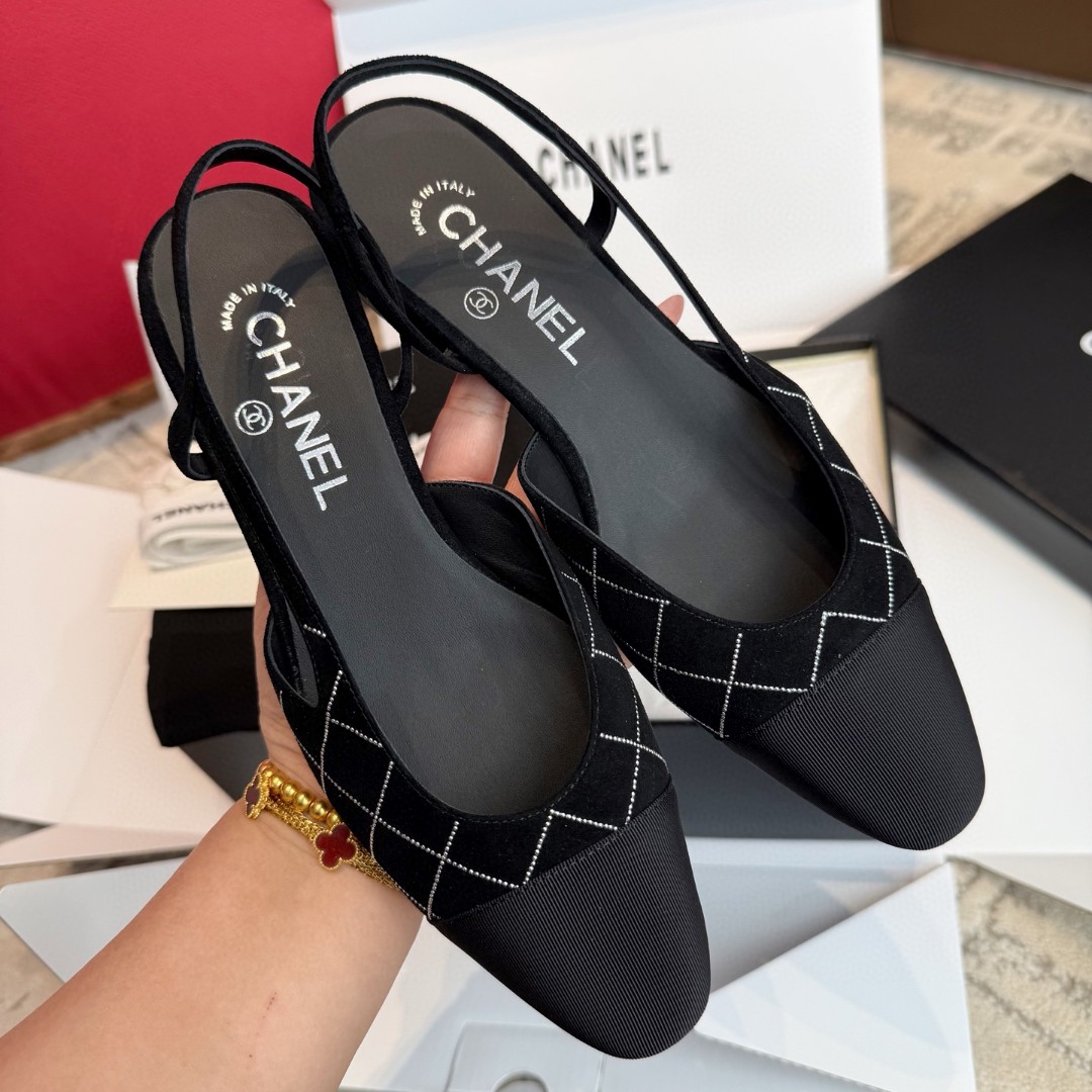 Chanel slingback shoes in black with a quilted pattern and cap toe