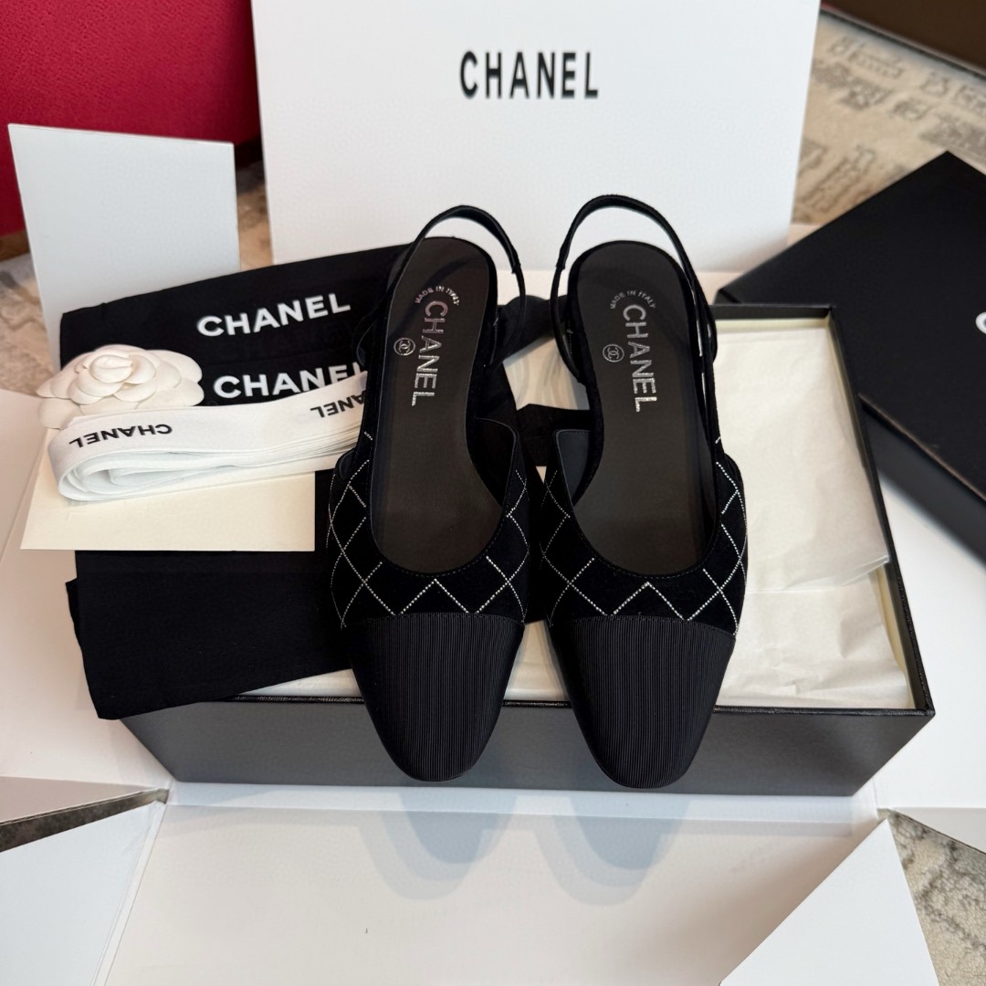 Chanel slingback shoes in black with a quilted pattern and cap toe