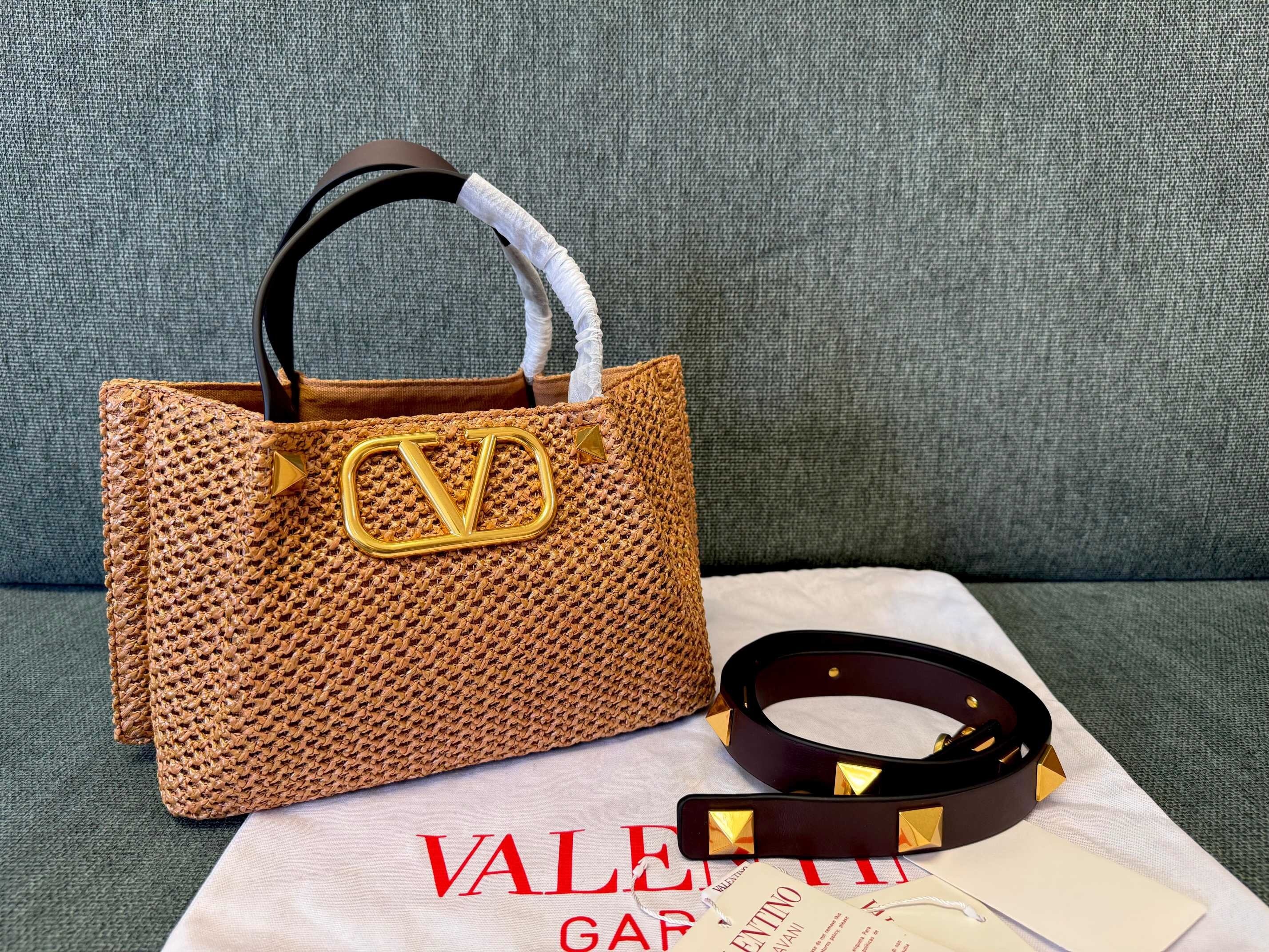 Valentino Garavani VLogo leather-trimmed raffia tote bag in a natural brown color